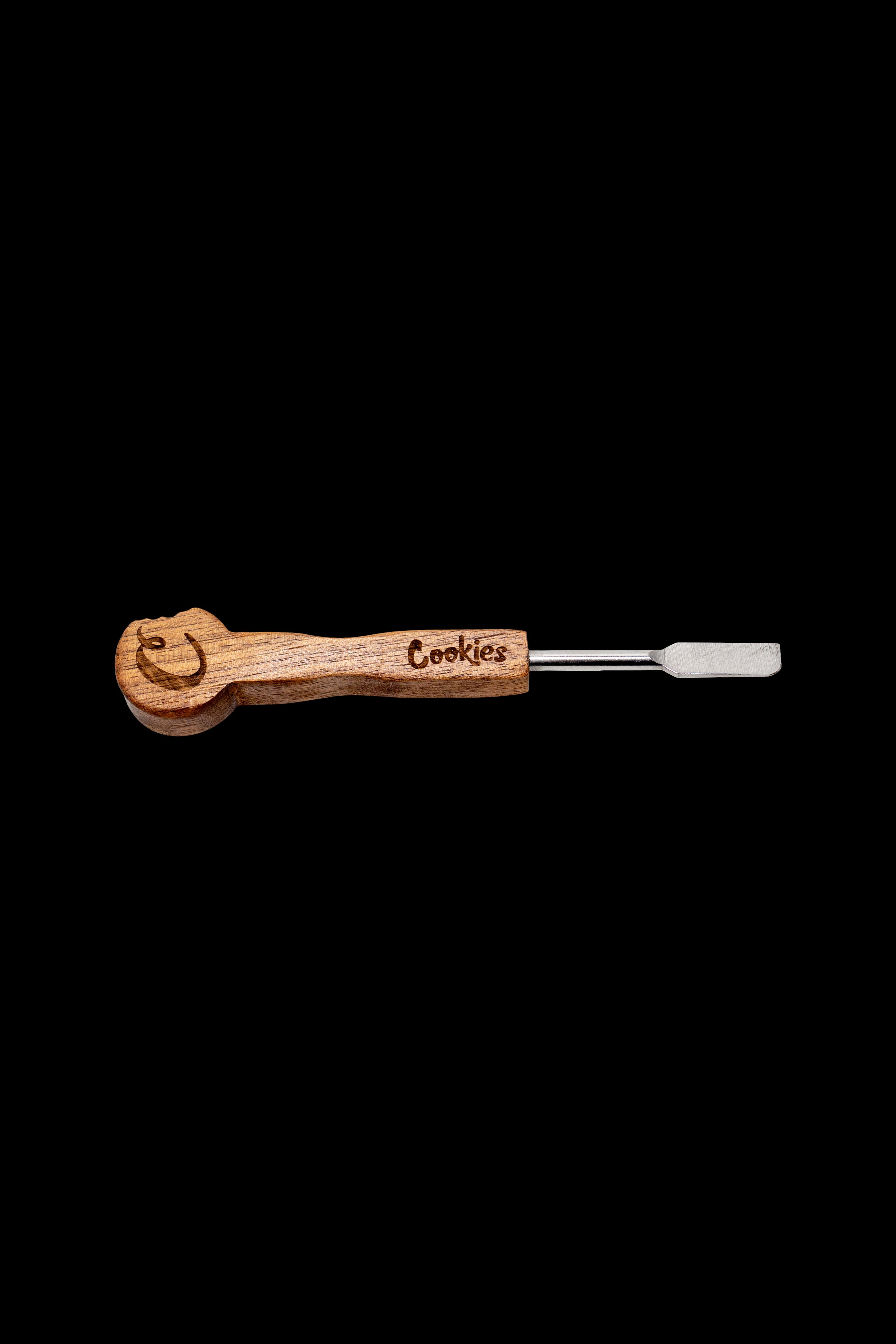 Wooden dab tool with metal tip and "Cookies" branding on a black background.