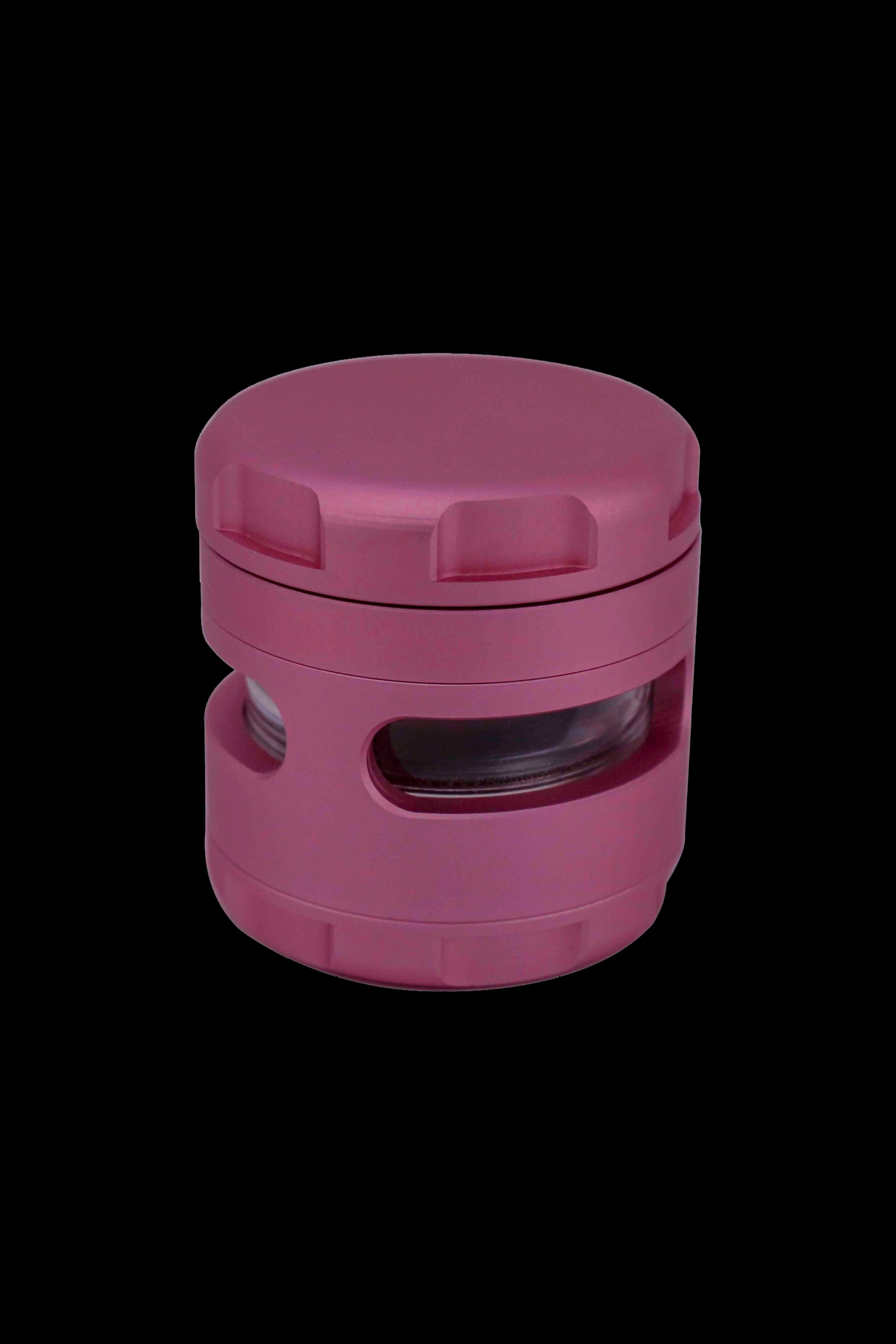 Pink four-piece cannabis grinder with a clear viewing window.
