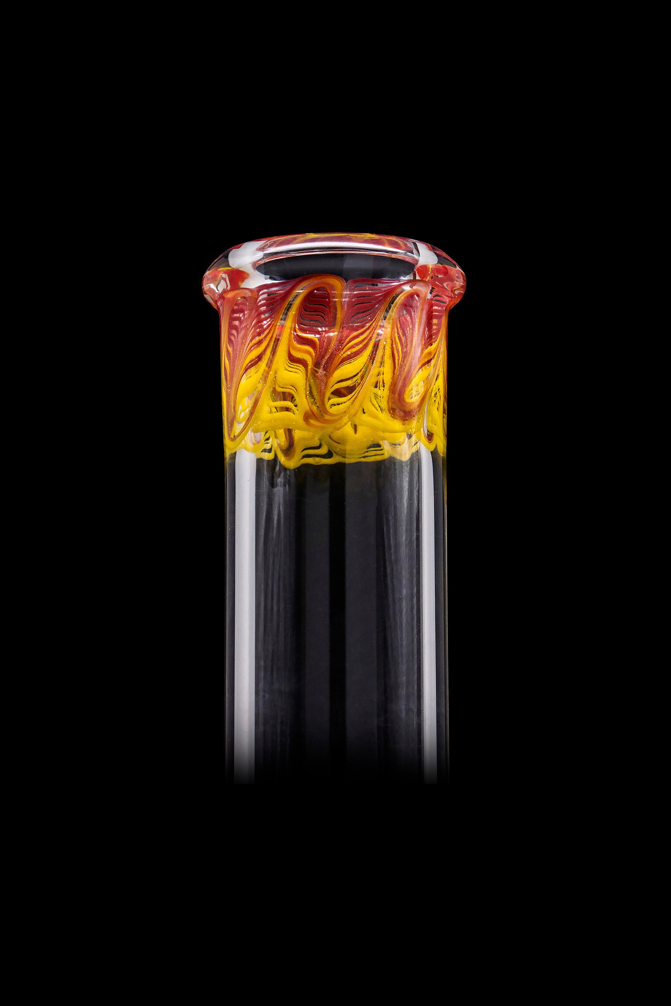 Handblown glass cannabis oil rig attachment with vibrant orange and yellow swirling patterns.