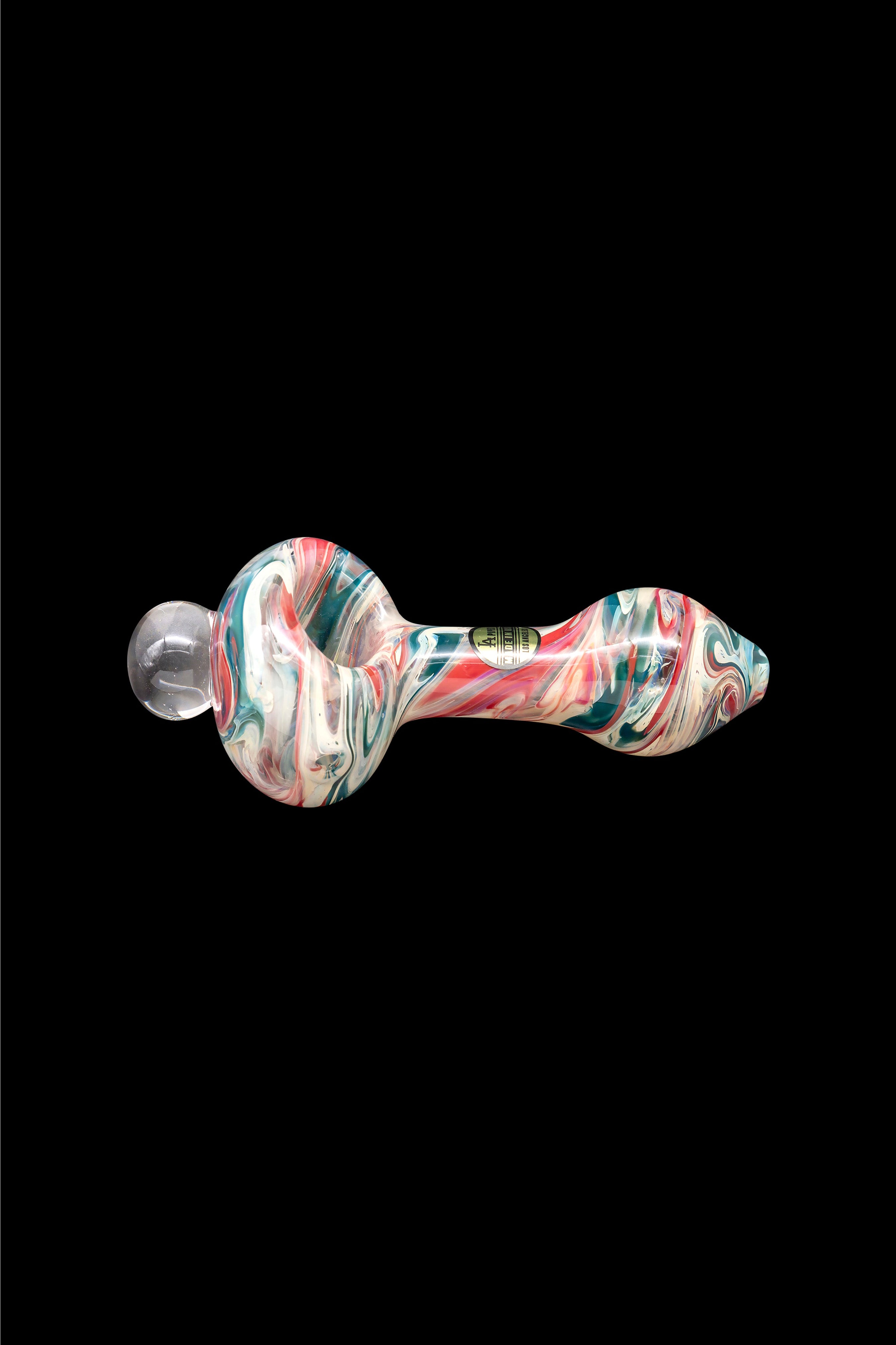 Colorful glass pipe against a black background.