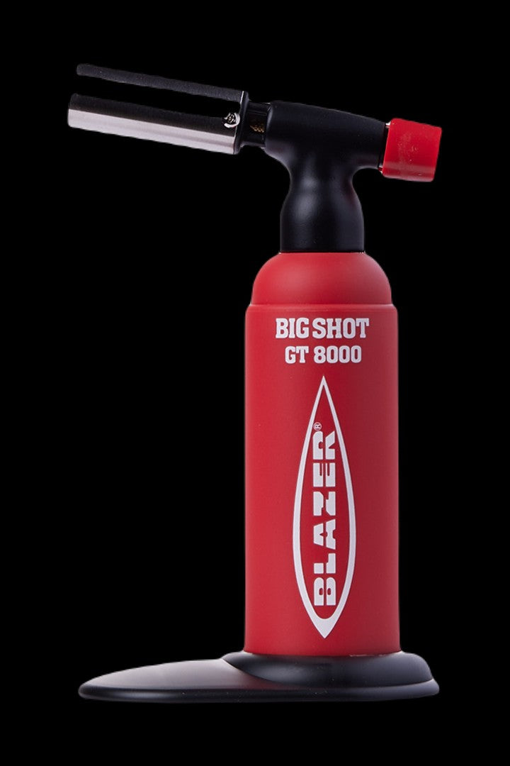 Red butane torch lighter for dabbing cannabis concentrates.