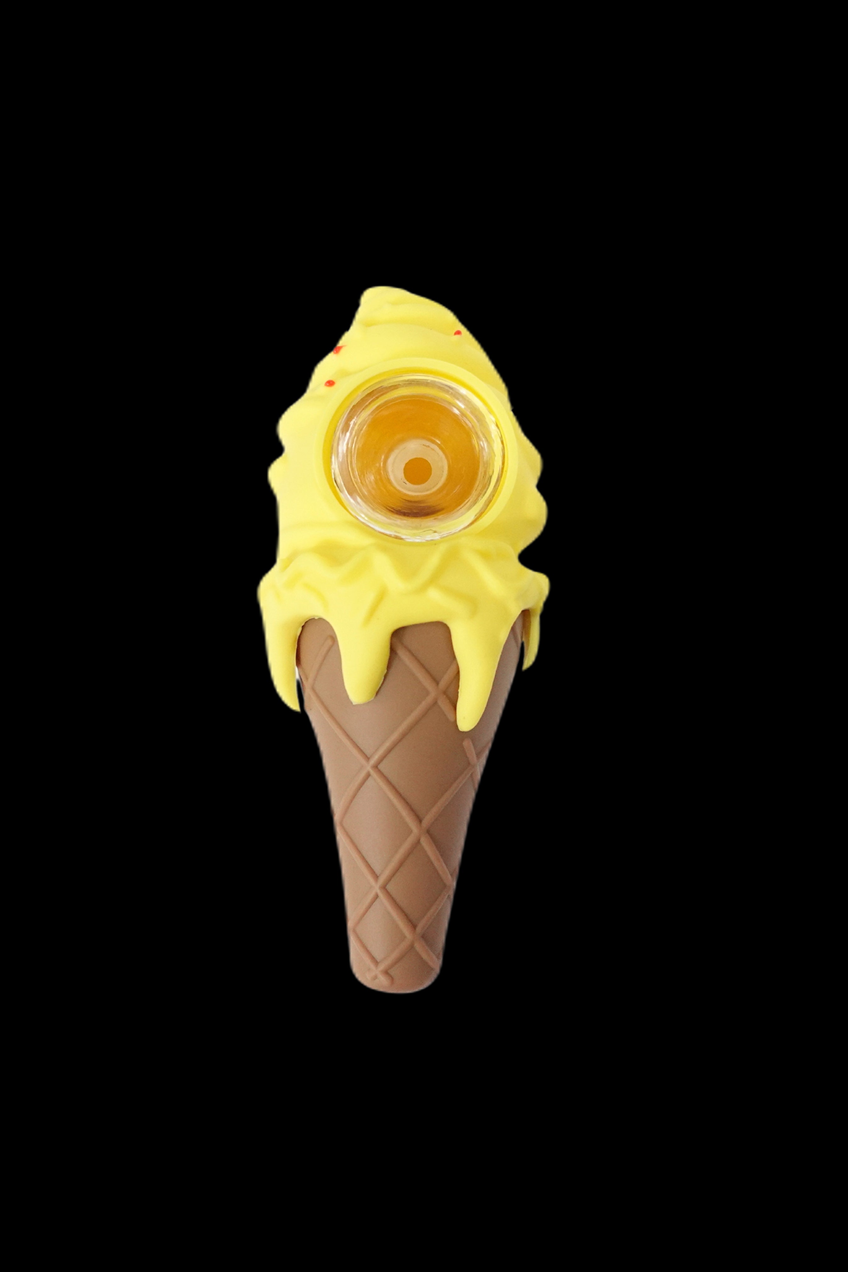 Yellow glass pipe shaped like a melting ice cream cone on a black background.