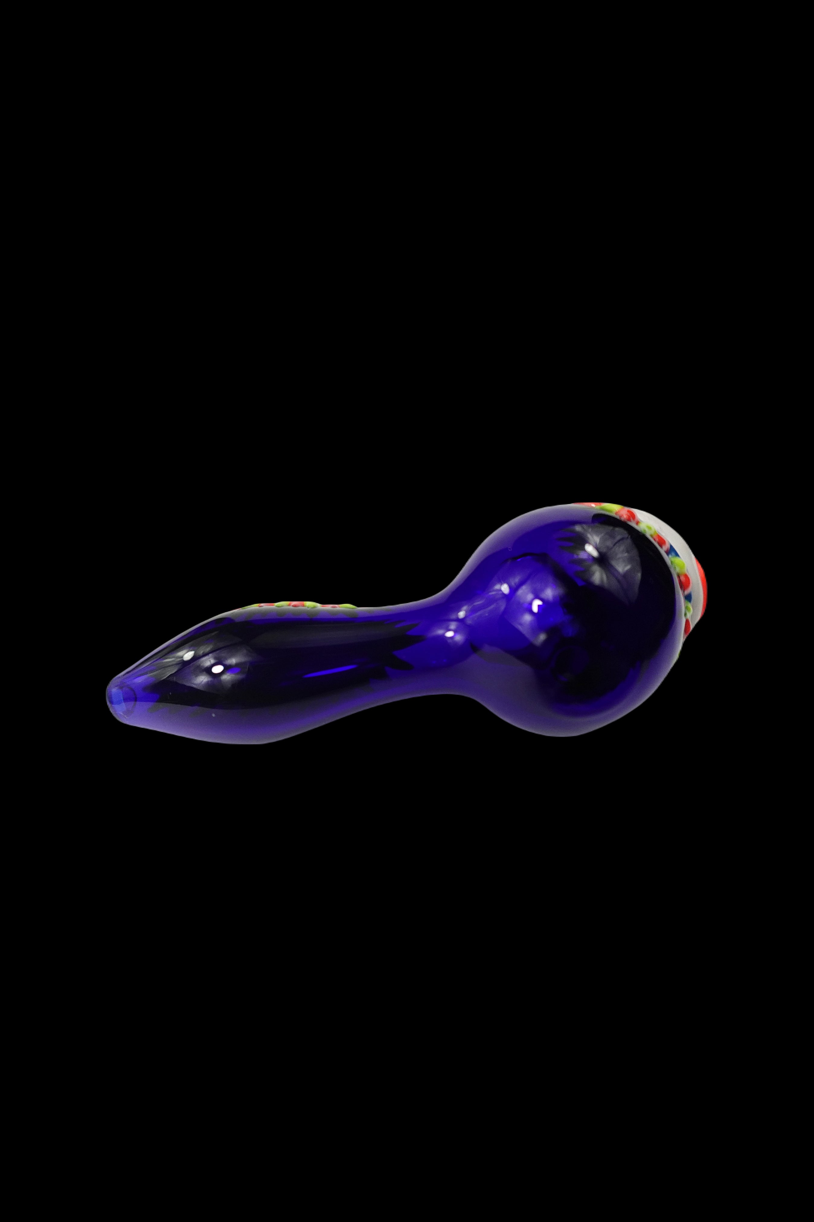 Purple glass pipe isolated on a black background.