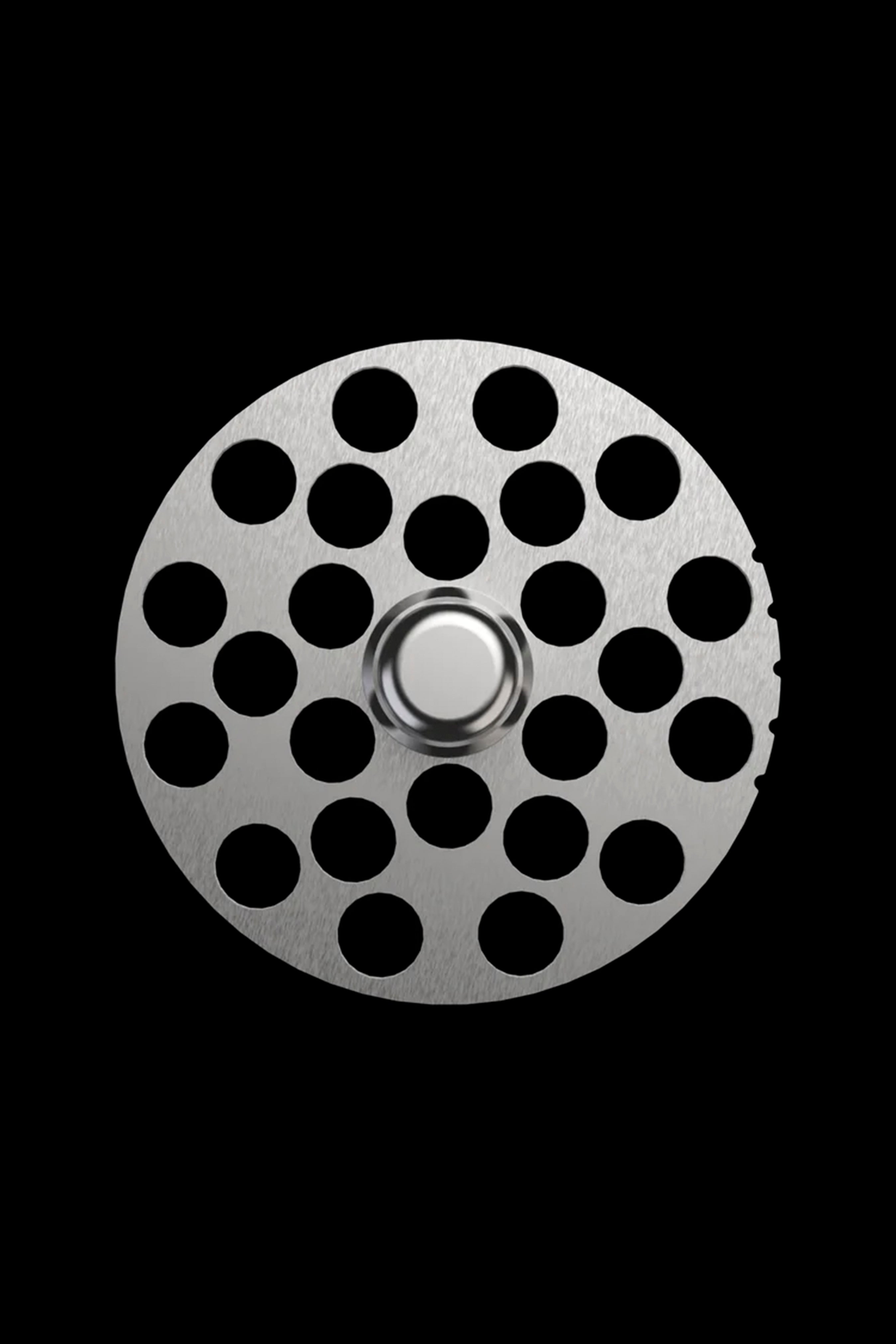 Metal grinder plate with numerous circular holes.