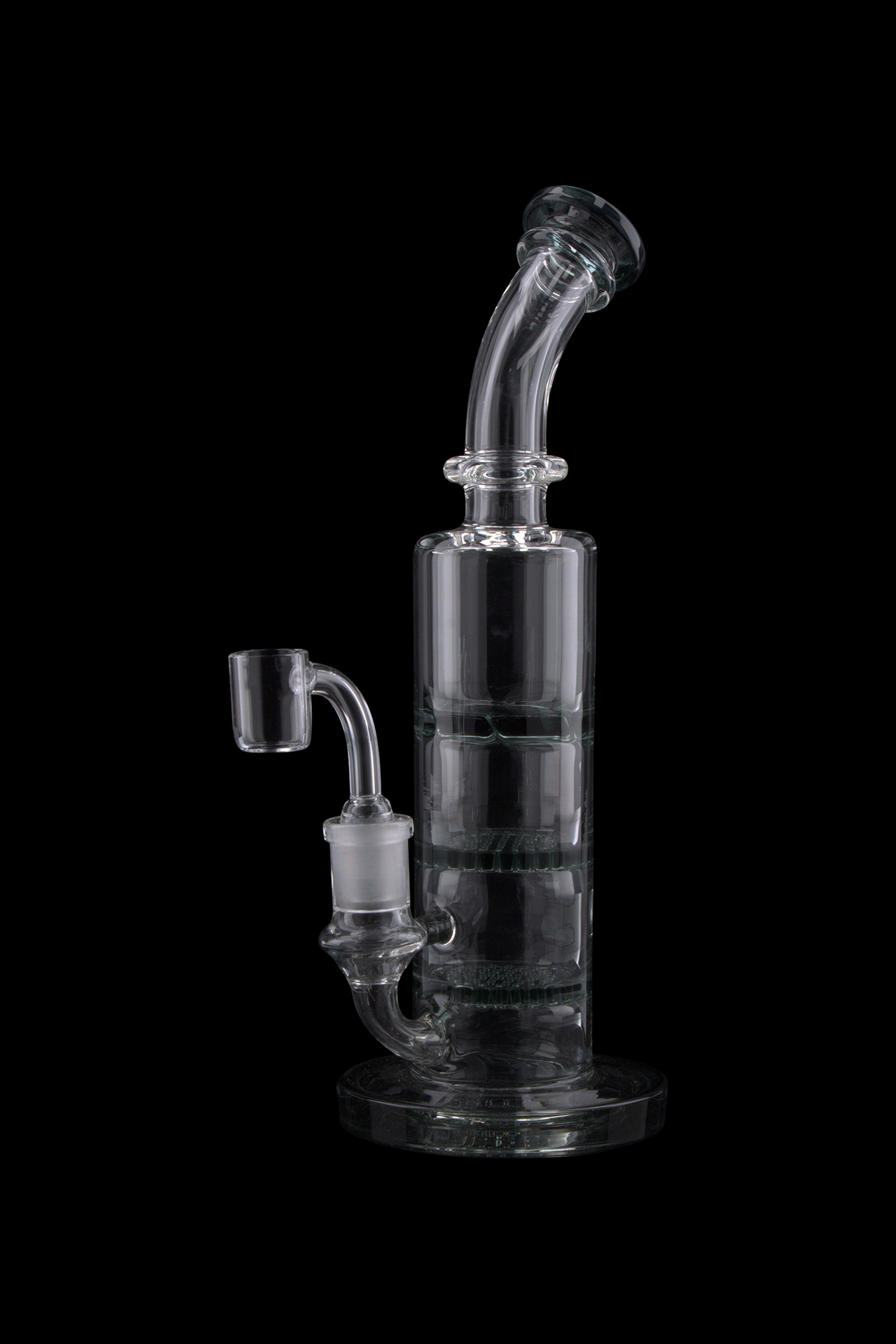 Angled close-up of the Triple Honeycomb Dab Rig showing its clear glass neck, percolator chamber, and joint against a black background.