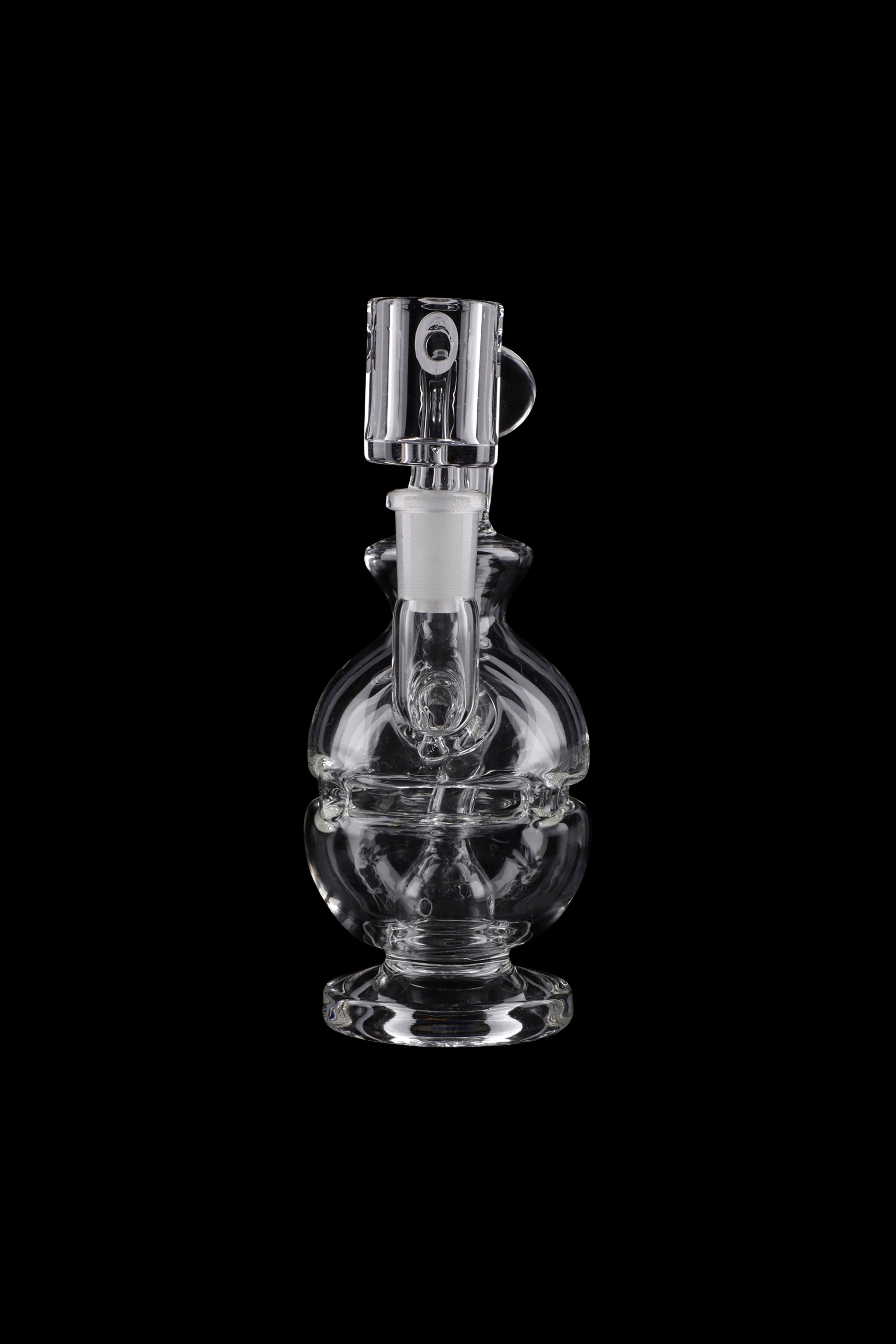Clear glass water pipe (rig) with intricate bubbler design, isolated on black.