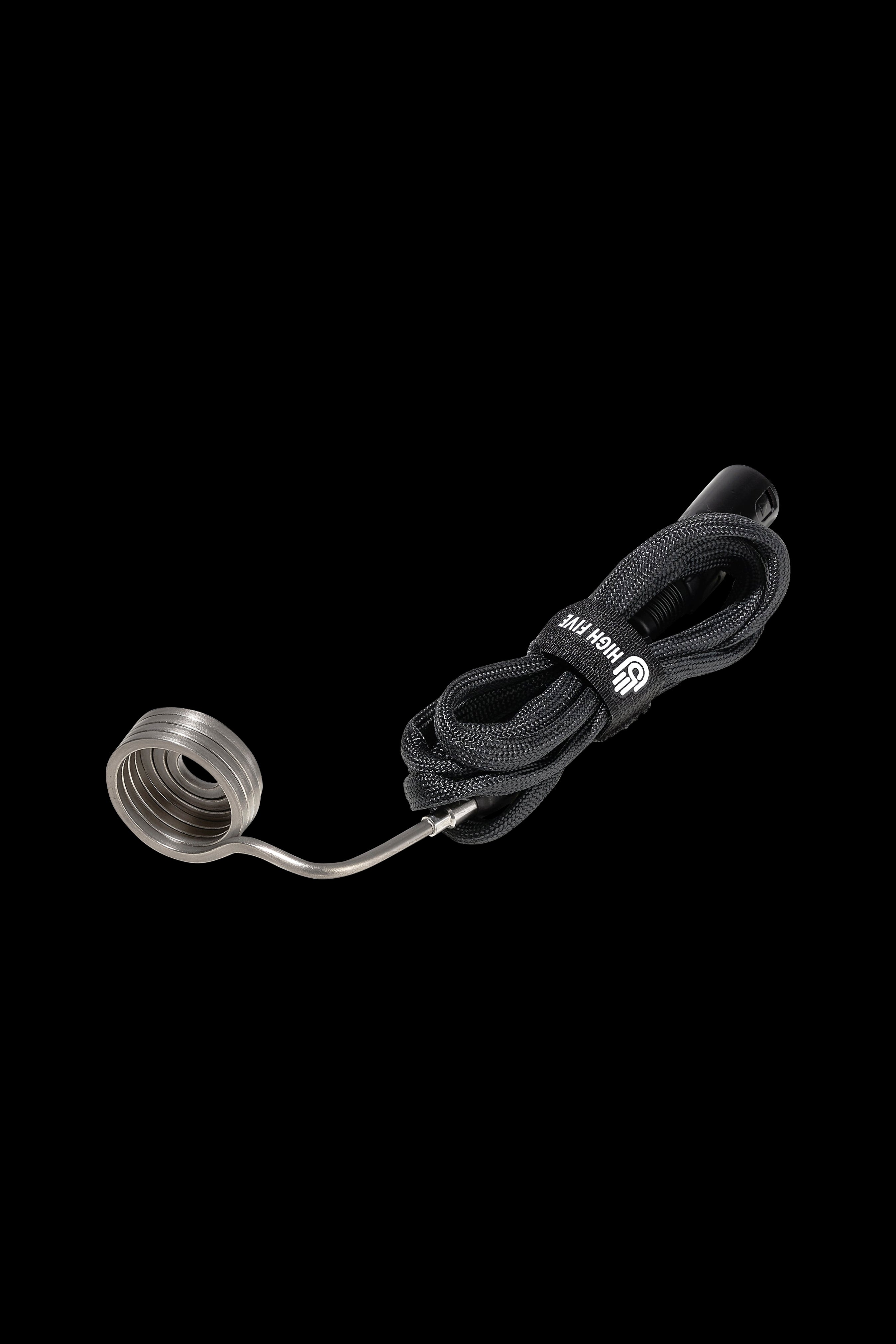 Black cannabis dab rig coil and braided rope accessory isolated on a black background.