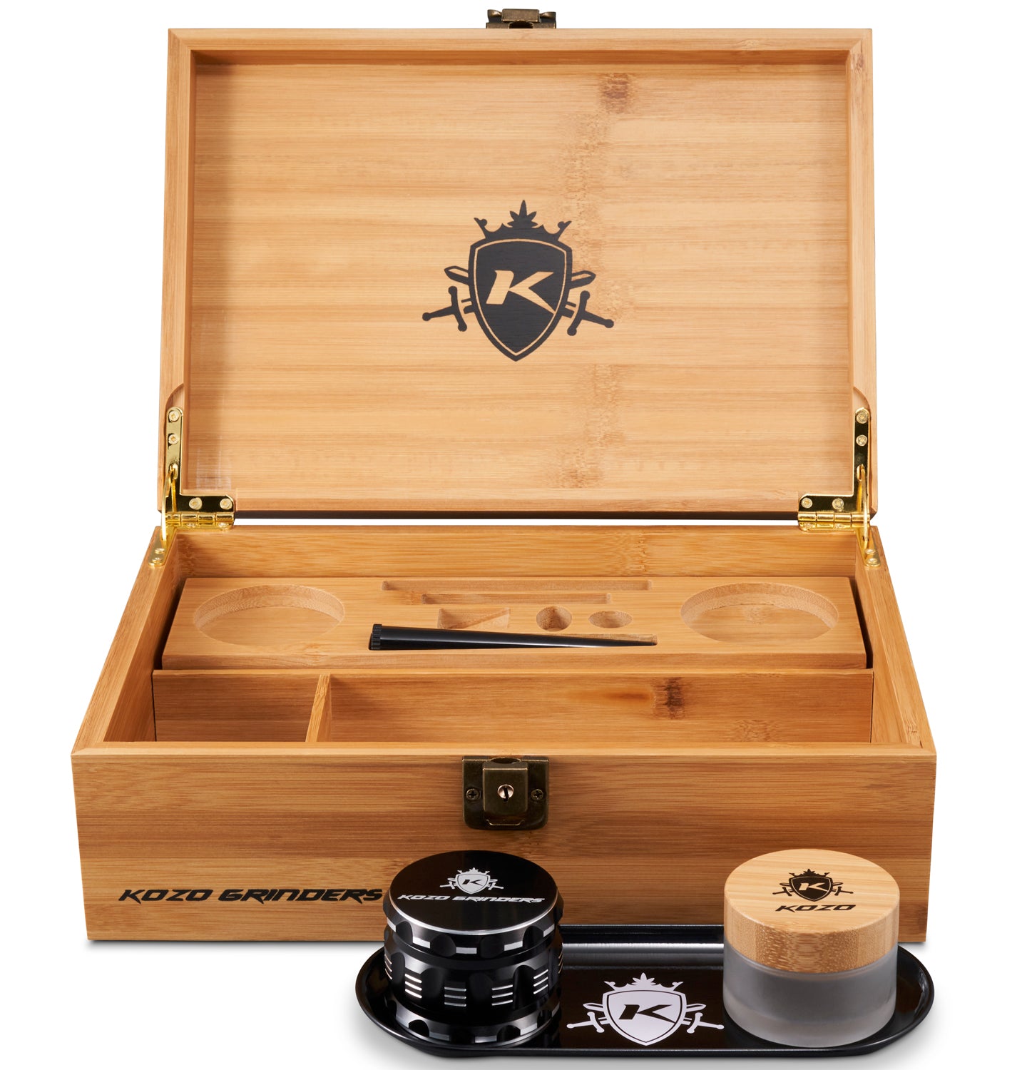 Wooden storage box with dividers open, displaying cannabis grinders and a storage container bearing the “Kozo Grinders” logo.