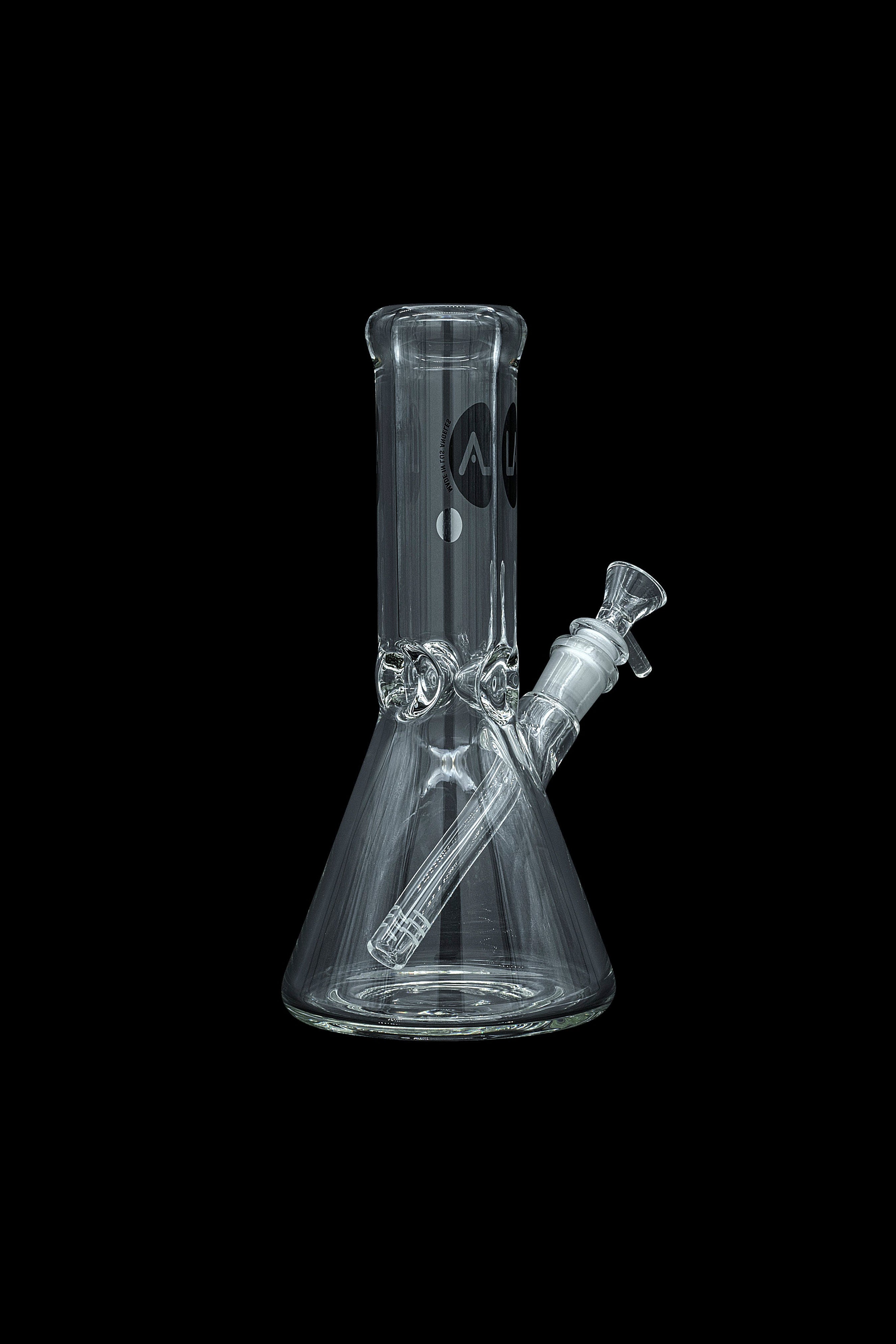 Clear glass bong isolated on a black background.