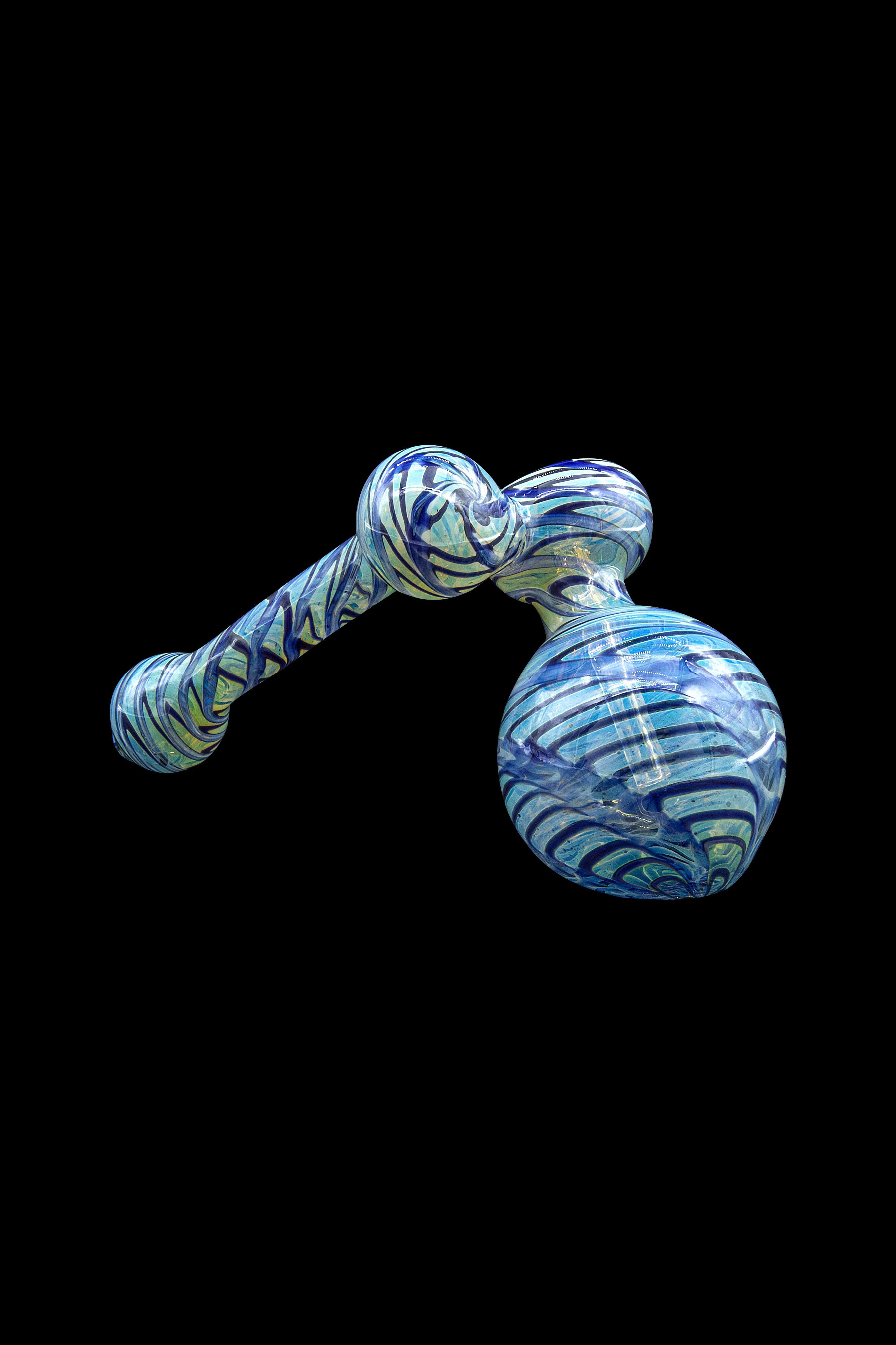 Blue and white patterned glass water pipe against a black background.