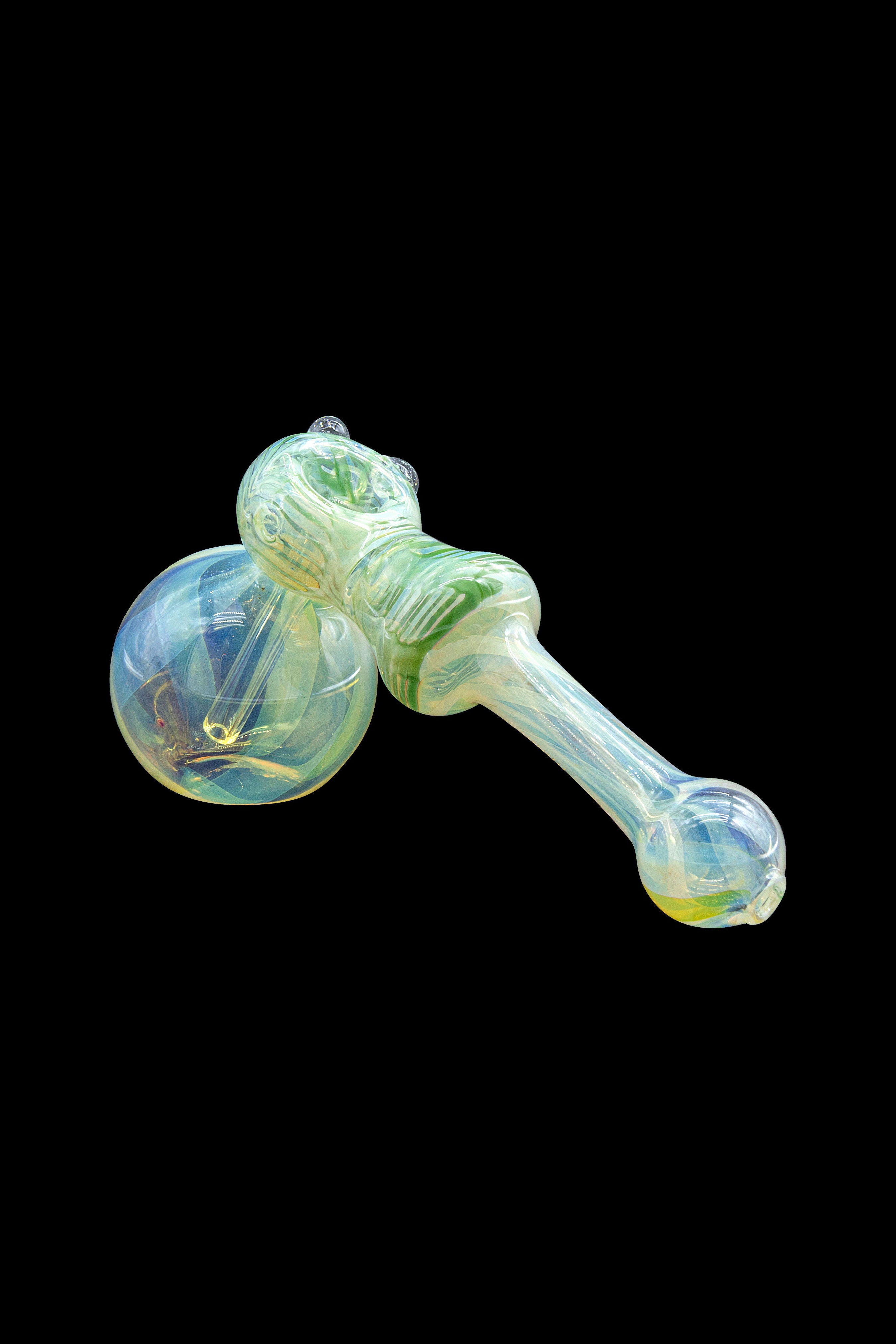 Green and yellow glass bubbler pipe isolated on a black background.