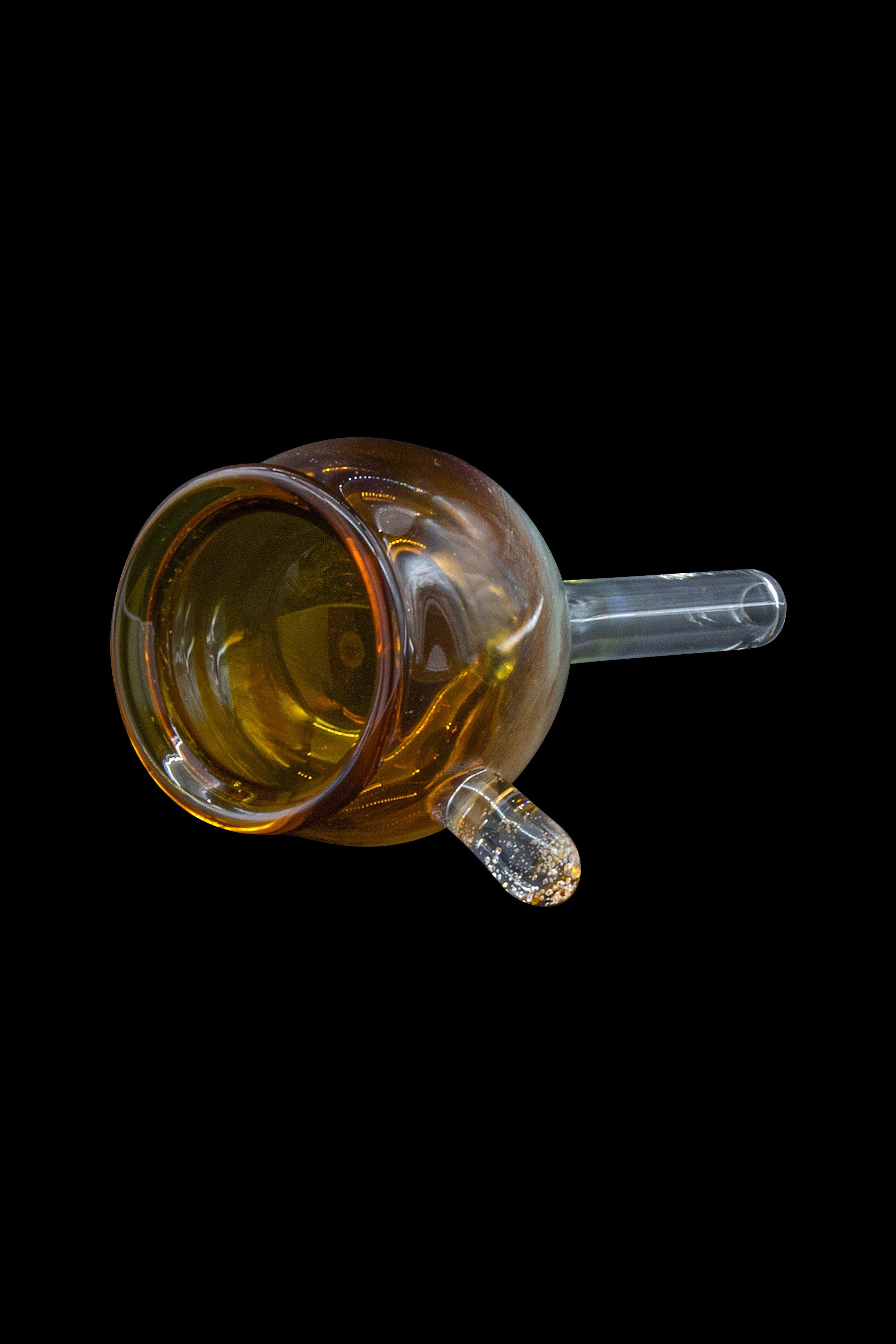 Amber glass bubbler with clear mouthpiece against a black background.