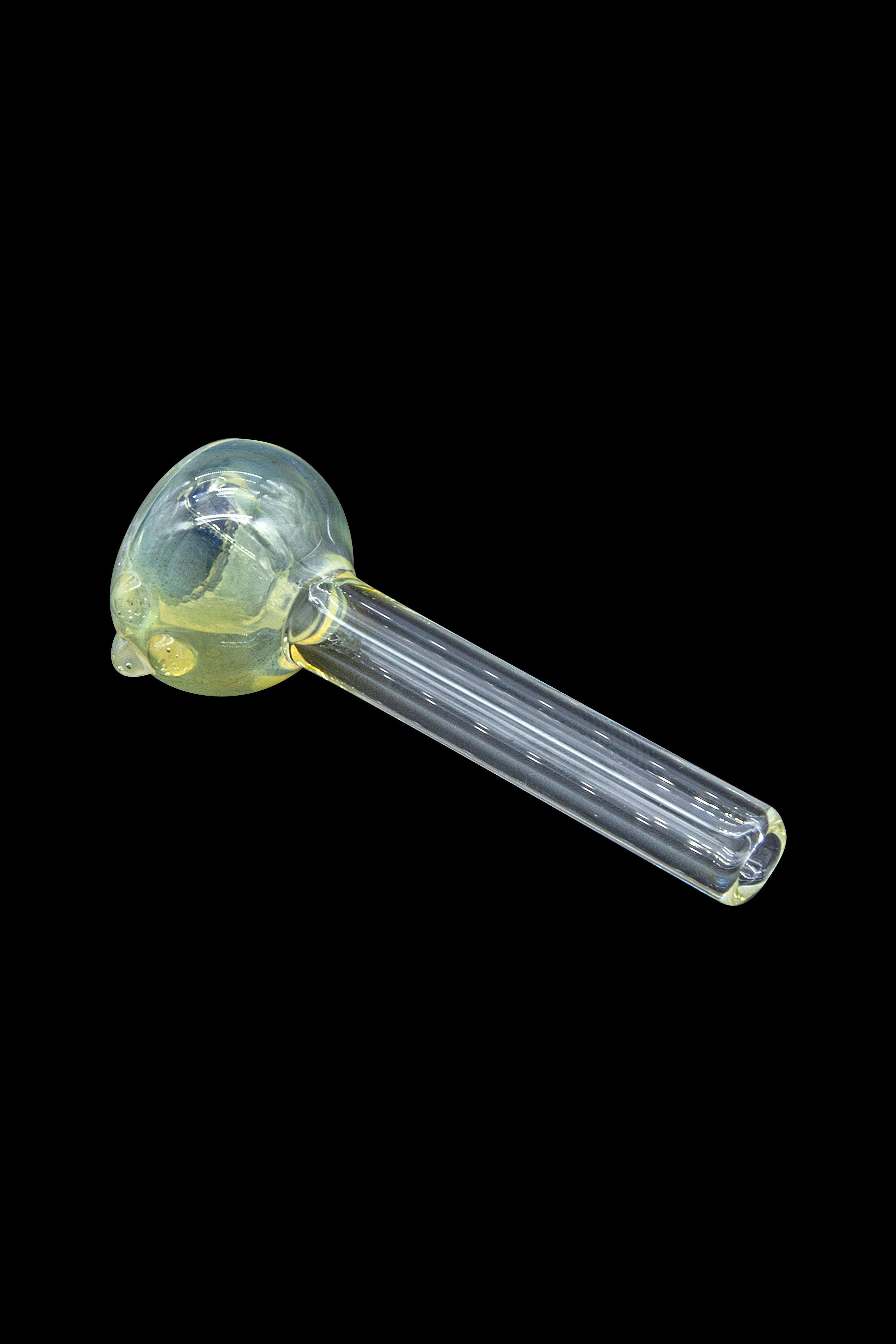 Glass cannabis pipe with a pale yellow, speckled bowl and clear stem against a black background.