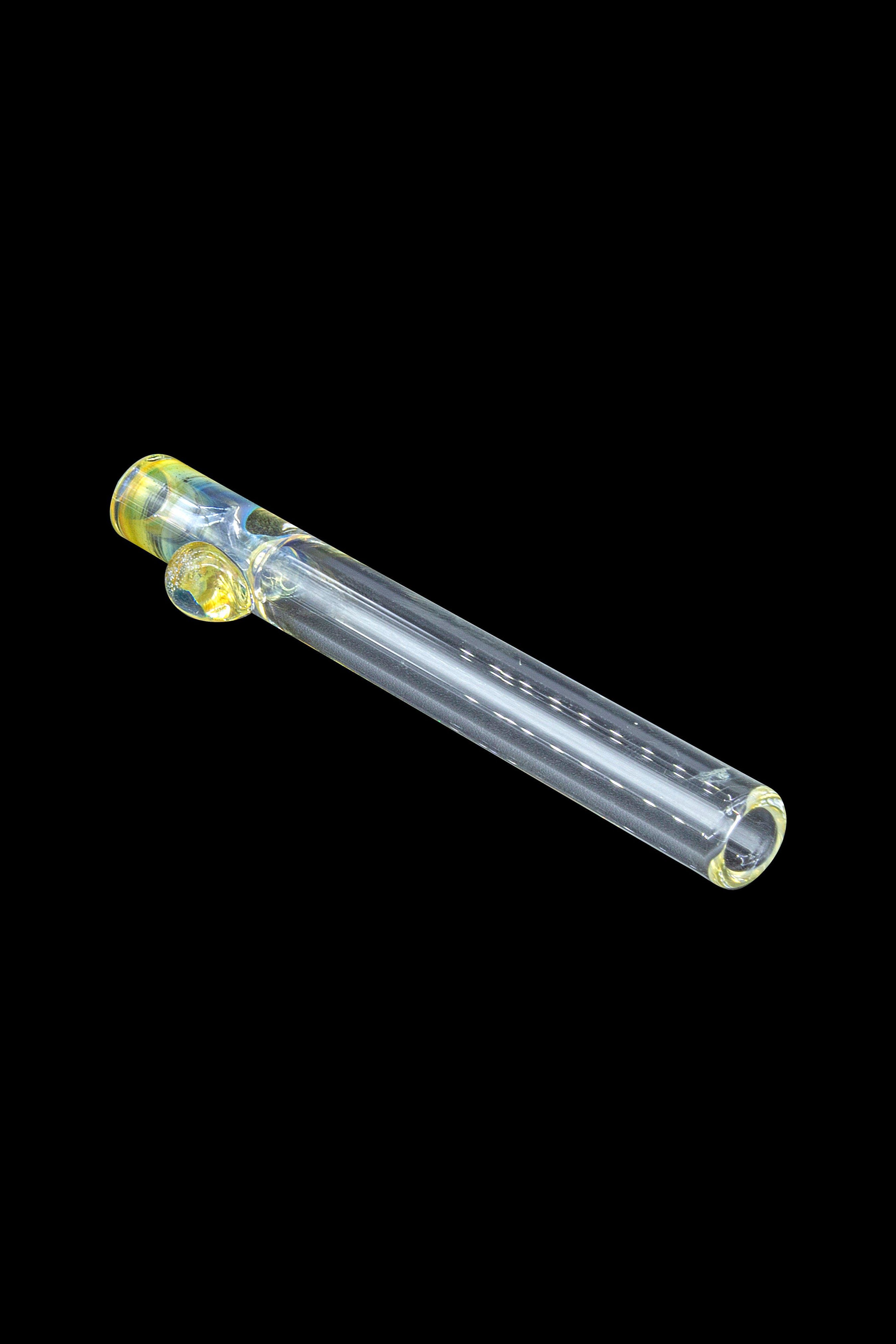 Glass cannabis pipe with iridescent yellow and gold accents, isolated on a black background.