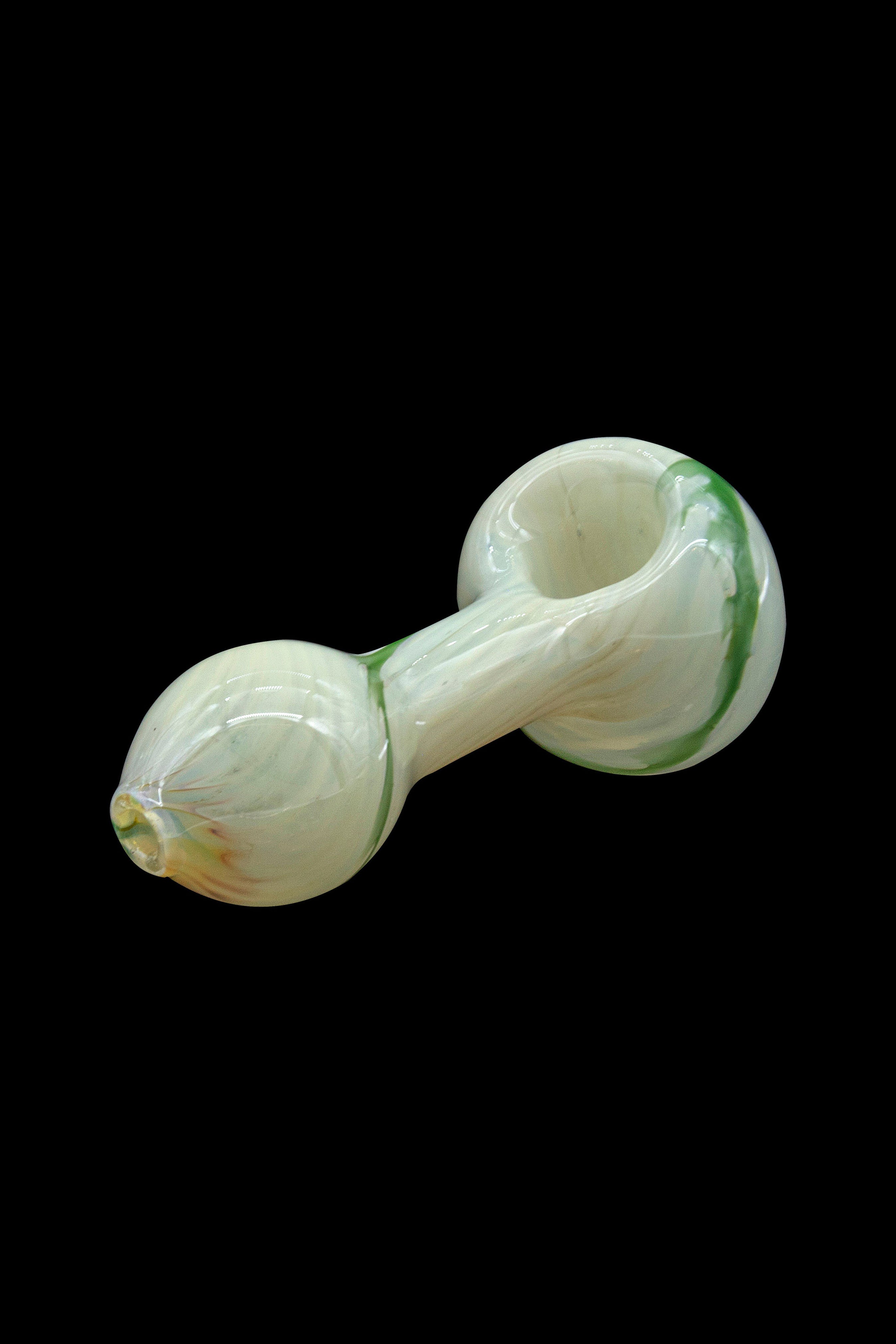 Pale green glass pipe isolated on a black background.