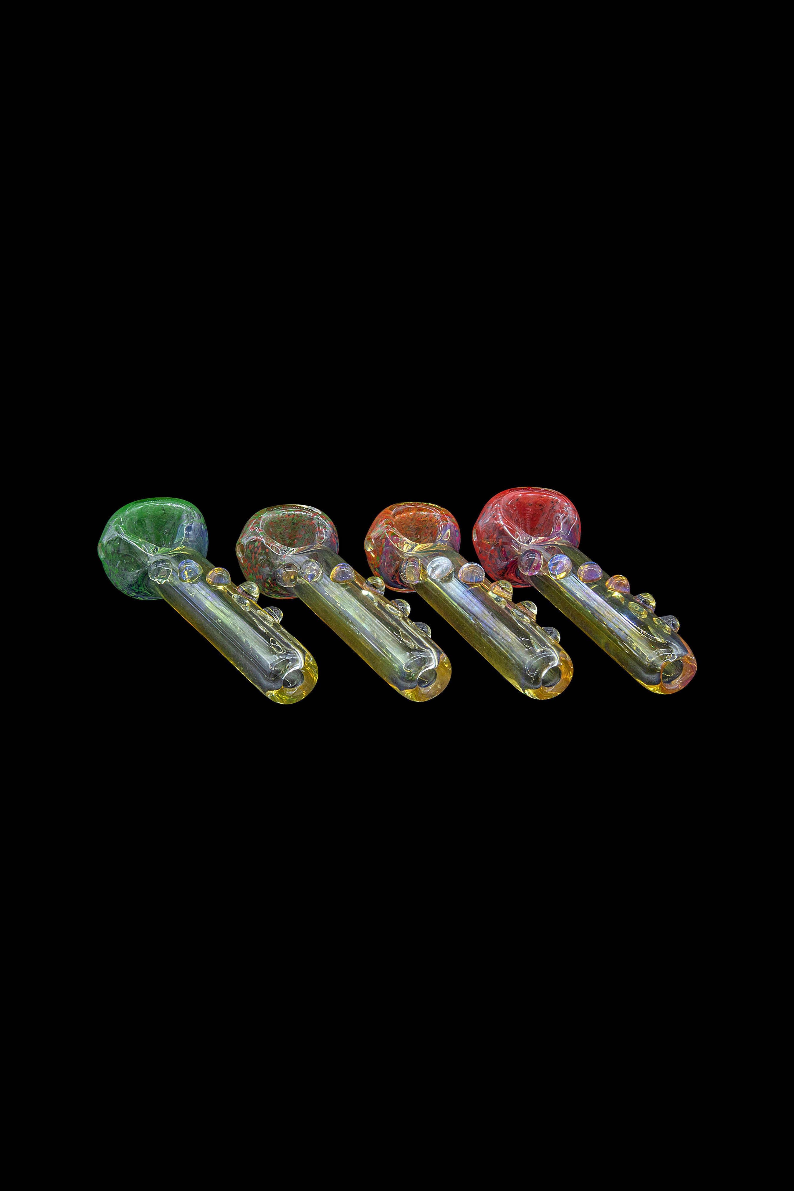 Assortment of colorful glass smoking pipes on a black background.