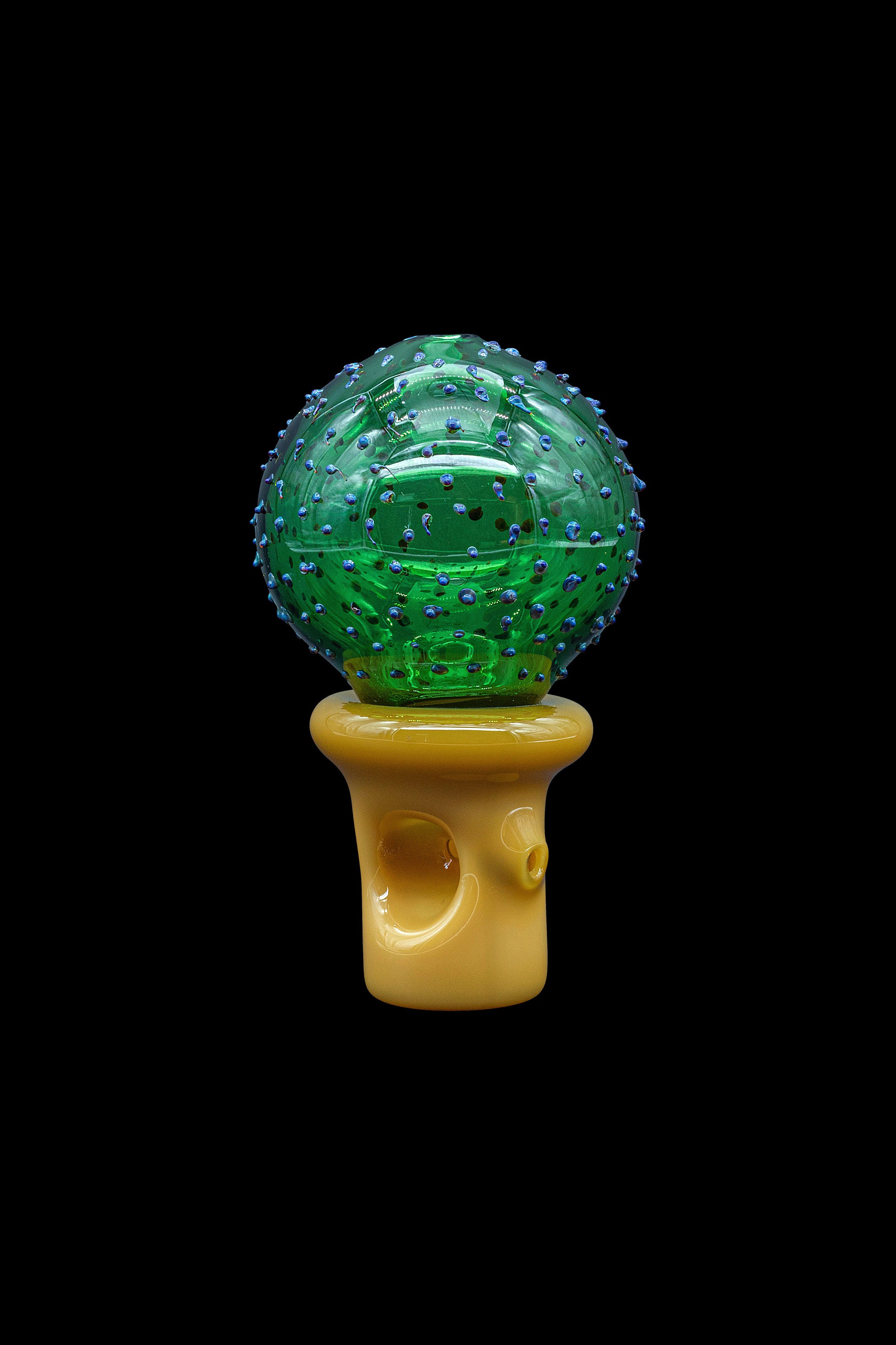 Green glass cannabis water pipe with textured, spherical chamber.