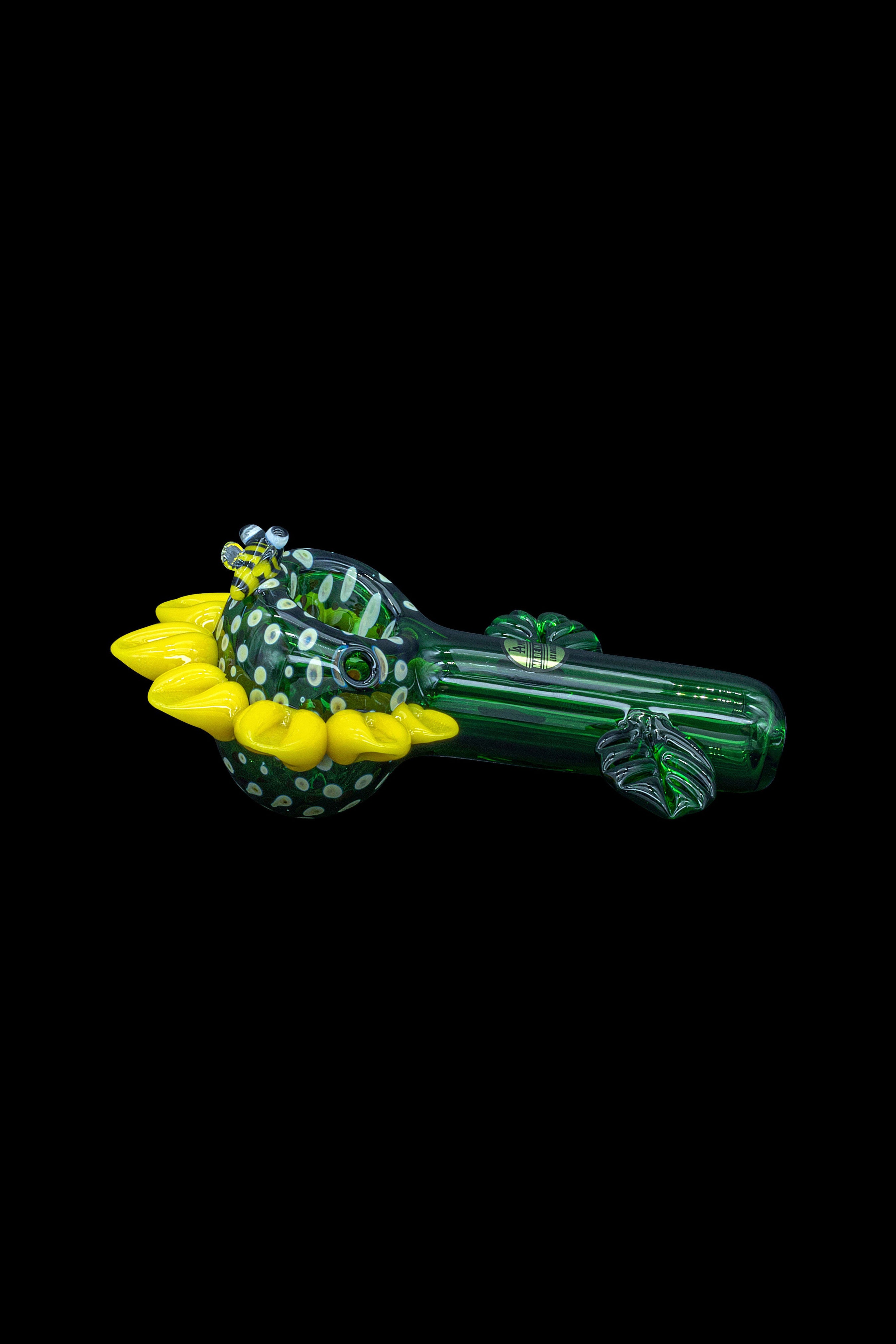 Green glass cannabis pipe shaped like a caterpillar with yellow and clear accents.