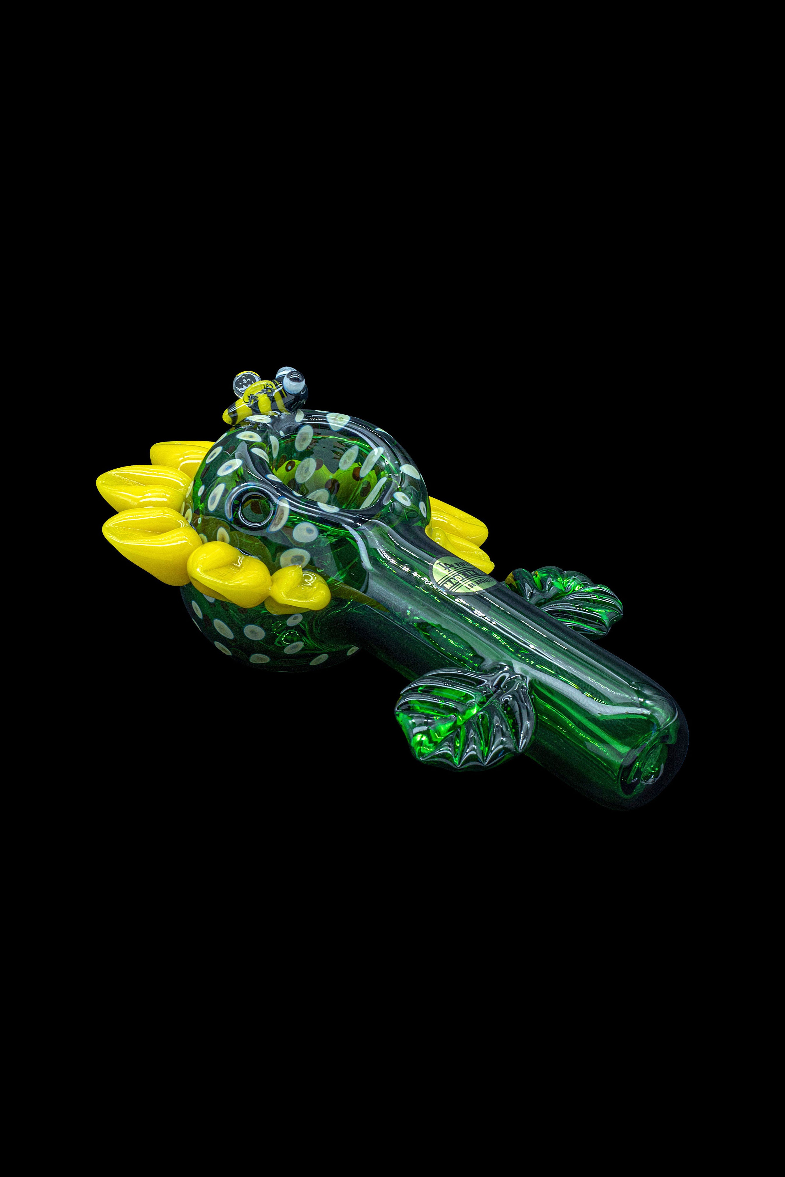 Hand-blown glass pipe shaped like a crocodile with vibrant green and yellow accents.