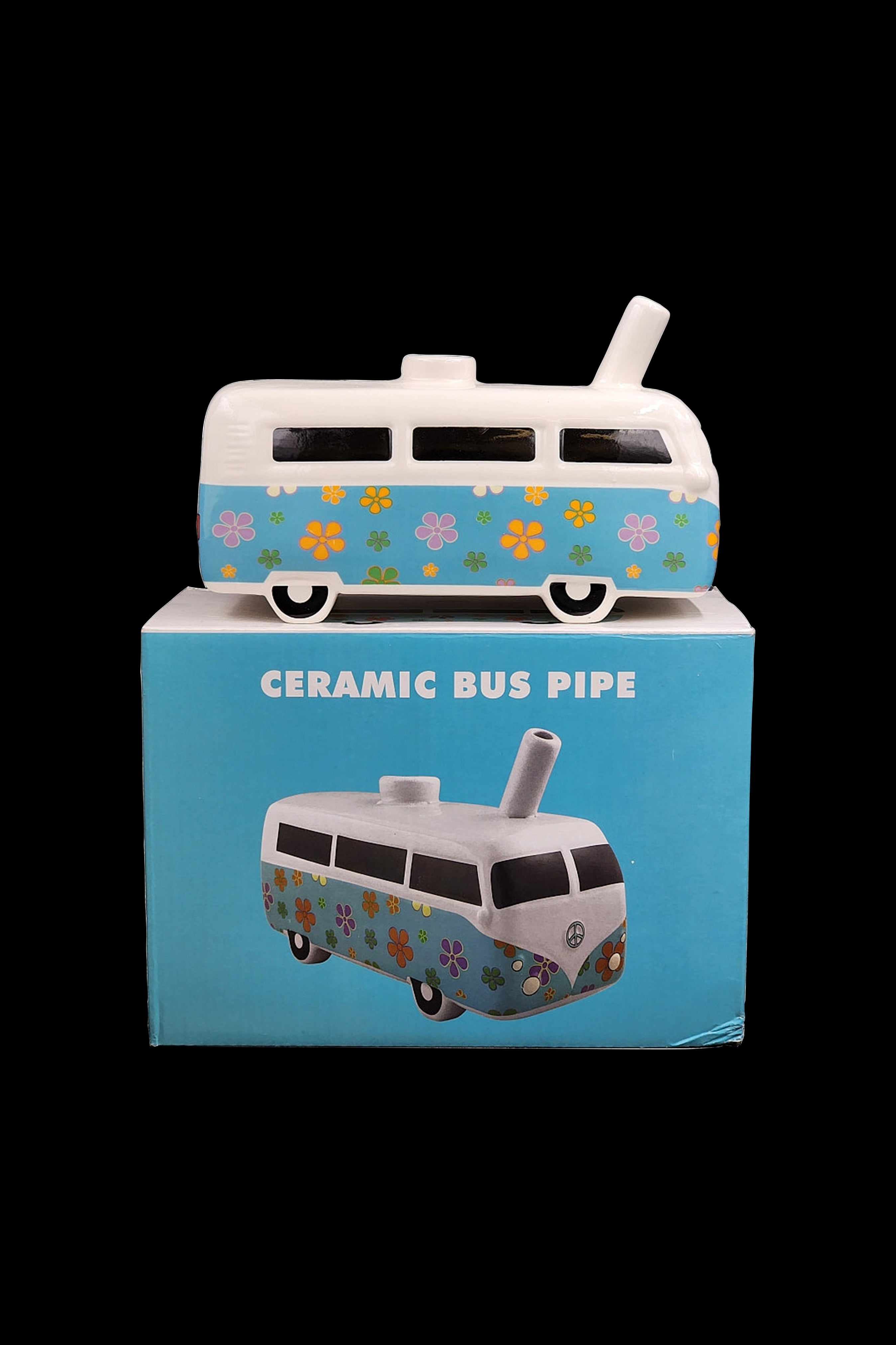 Ceramic cannabis pipe shaped like a vintage flower-patterned VW bus in its packaging.