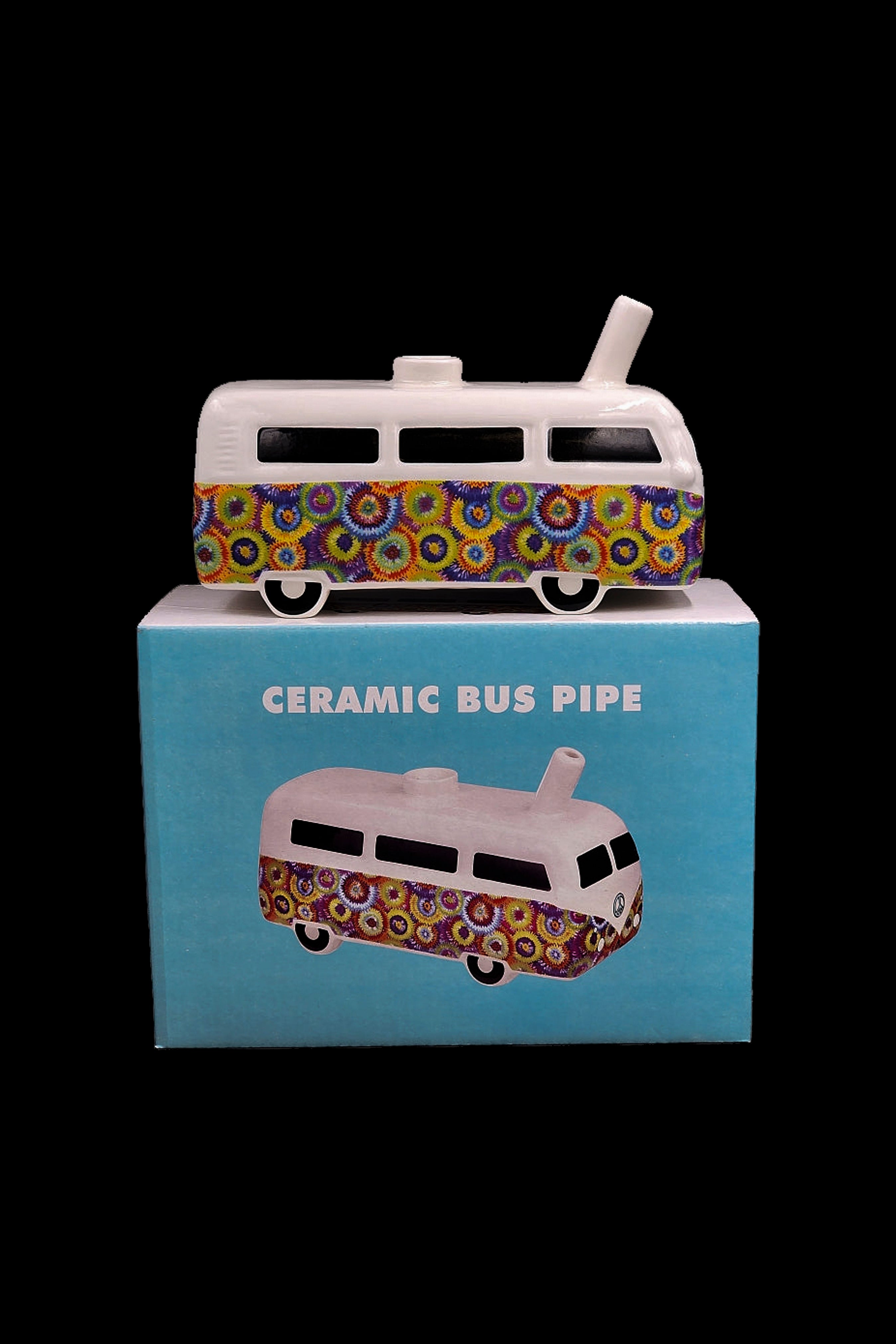Ceramic cannabis pipe shaped like a vintage Volkswagen bus in its retail packaging.