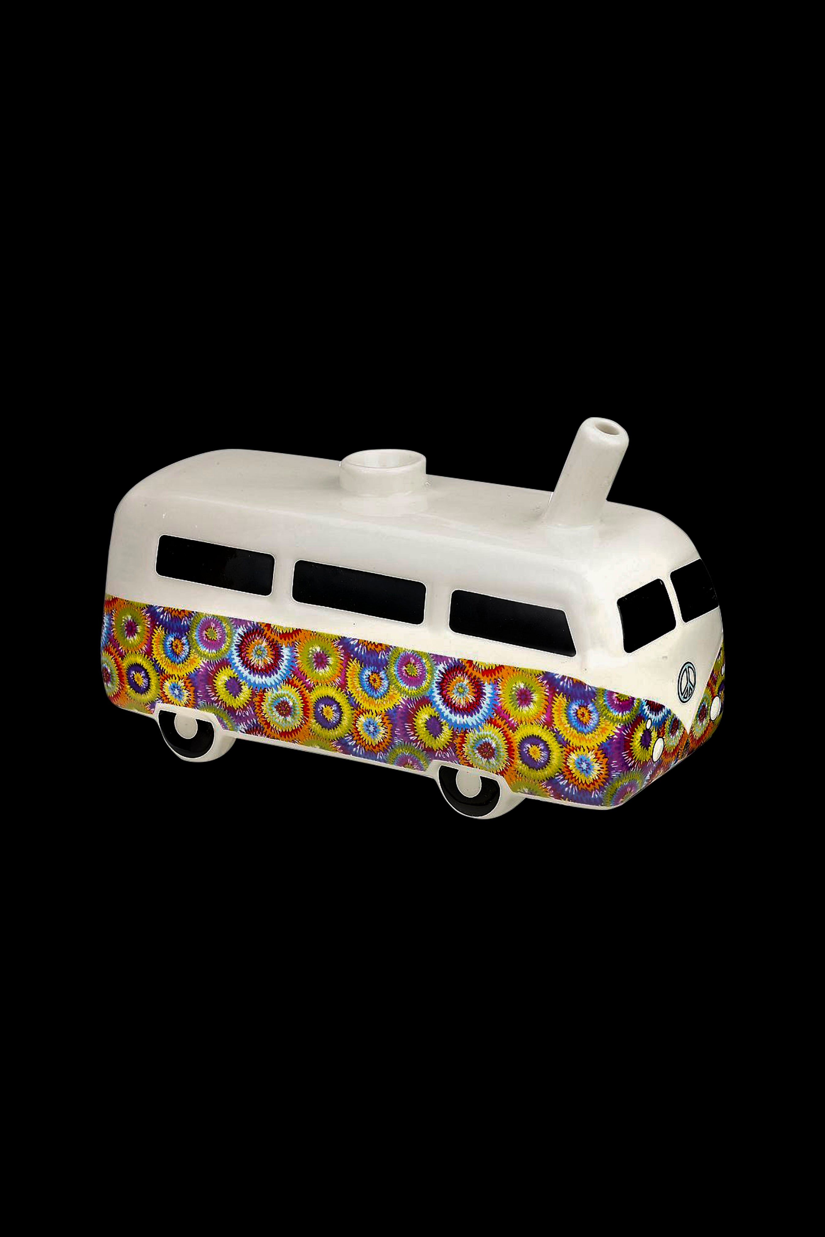 A ceramic pipe shaped like a psychedelic VW bus with a peace sign emblem.