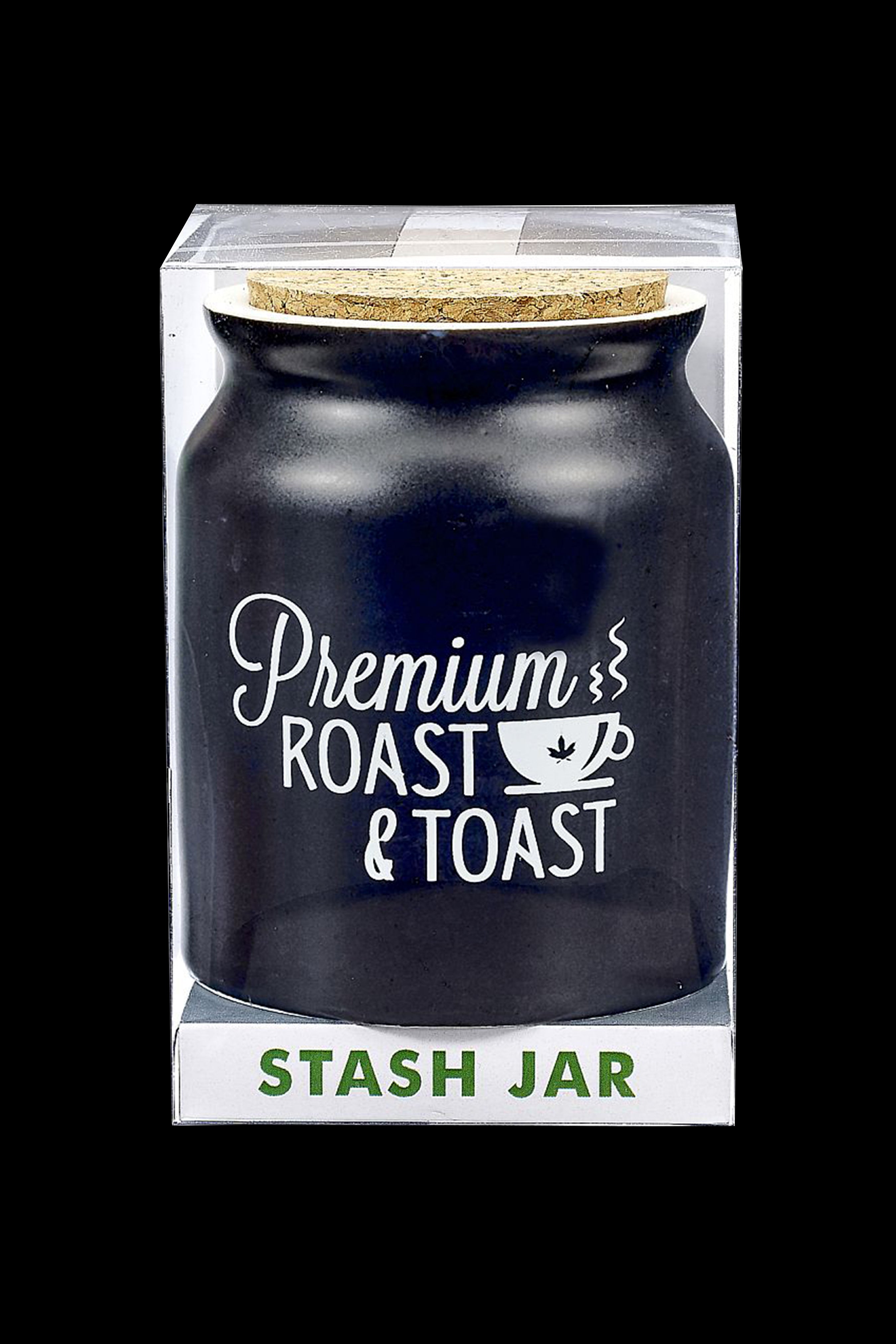 Black glass cannabis storage jar in clear packaging labeled “Premium Roast & Toast” and “Stash Jar”.