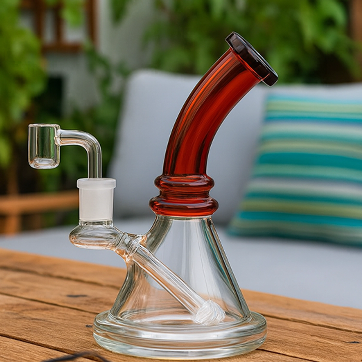 Angled close-up of the Mini Bent Neck Bong showing its black-tinted bent neck and clear beaker base on a wooden table.