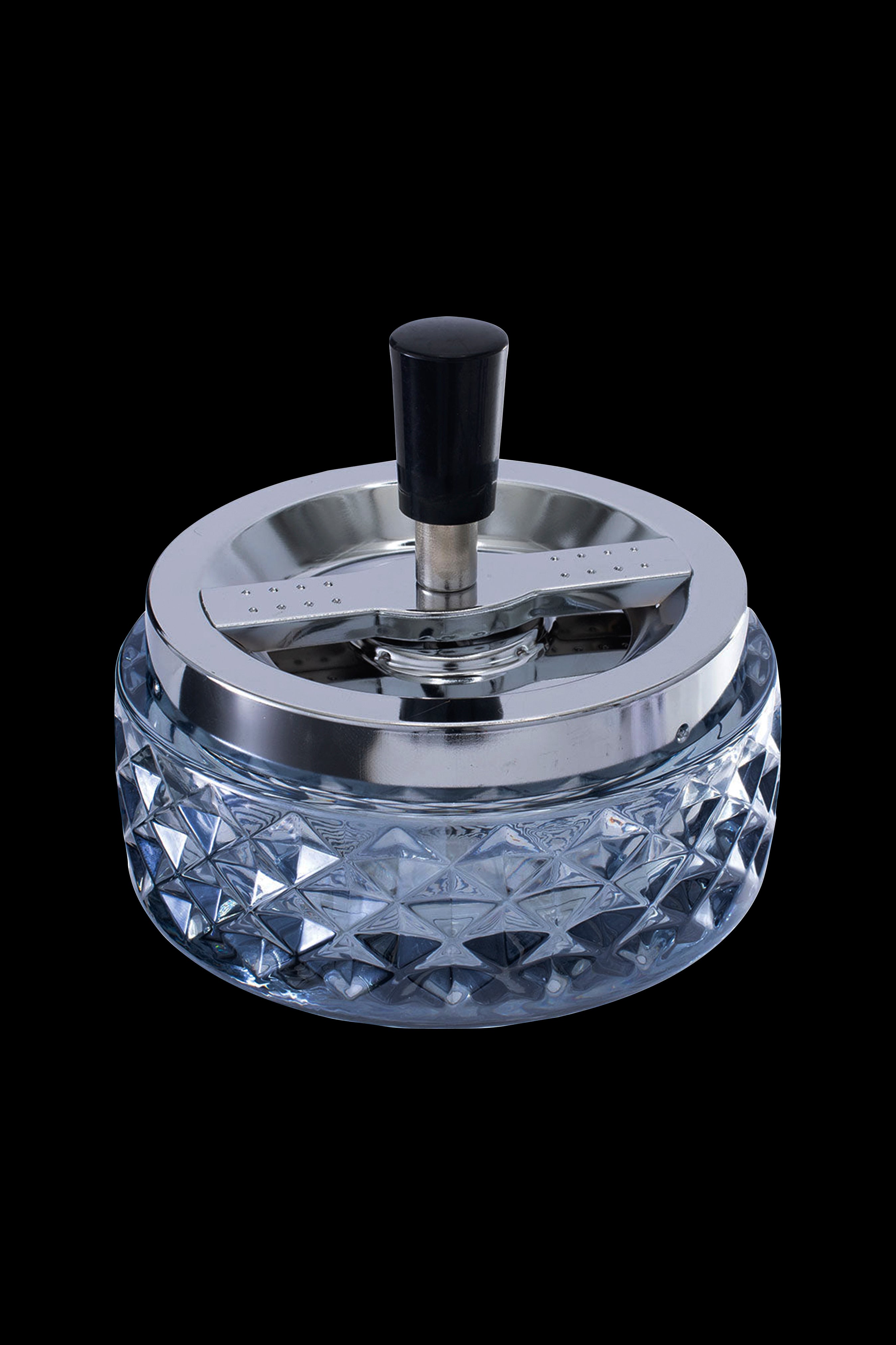 Crystal ashtray with a silver-tone spinning cover.