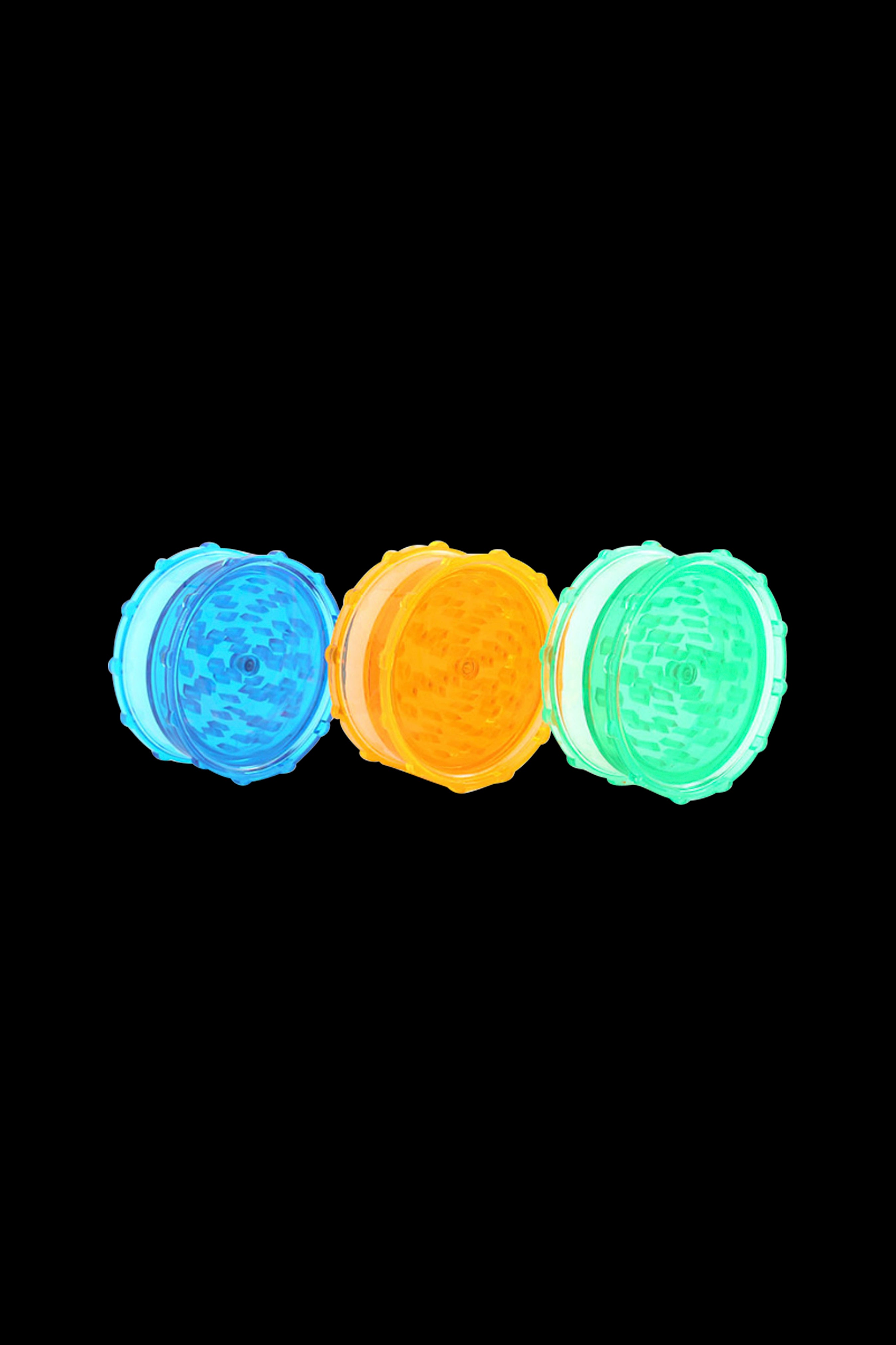 Three colorful cannabis grinders—blue, orange, and green—arranged in a row on a black background.