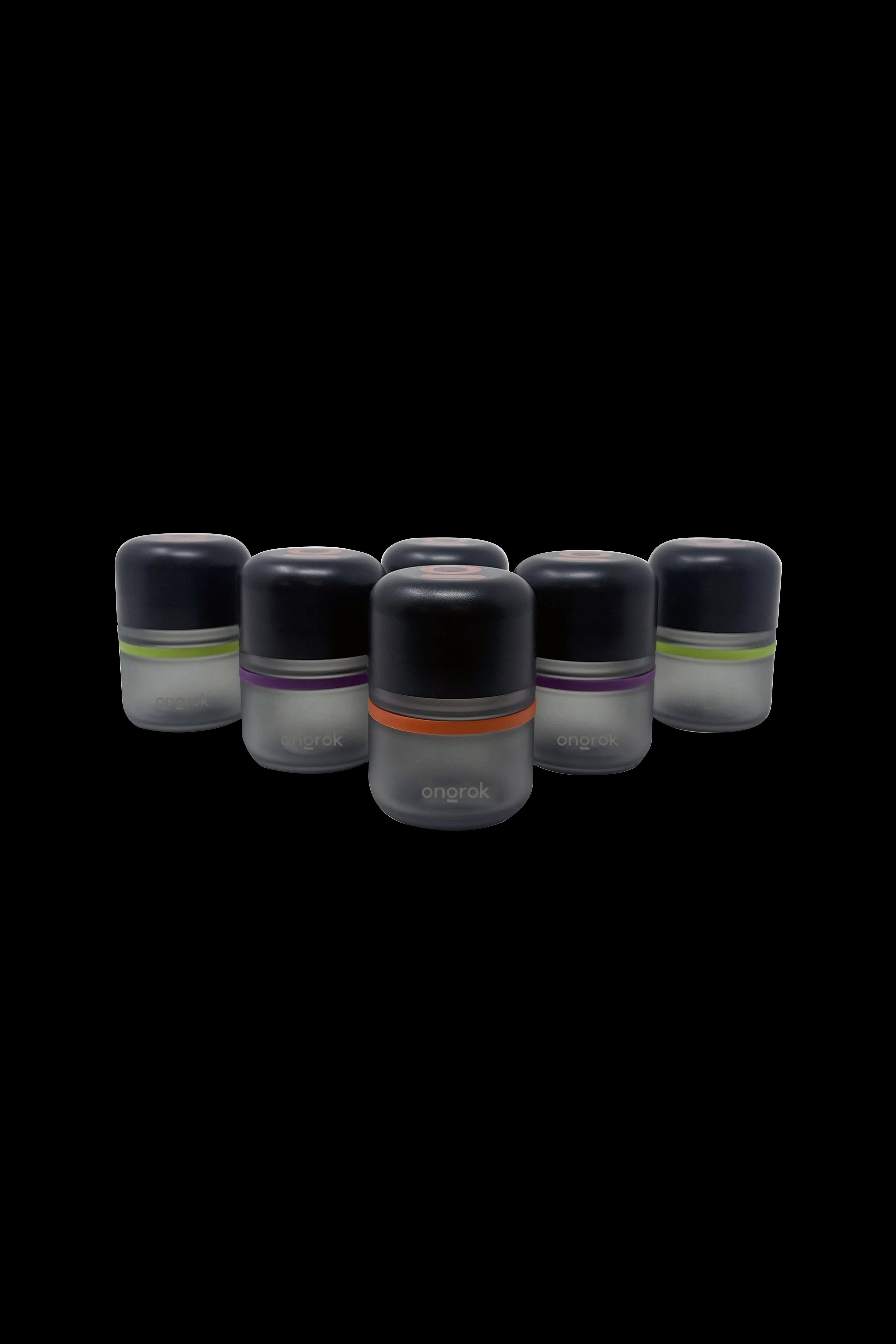Six Onrok cannabis oil cartridges with color-coded bands on a black background.