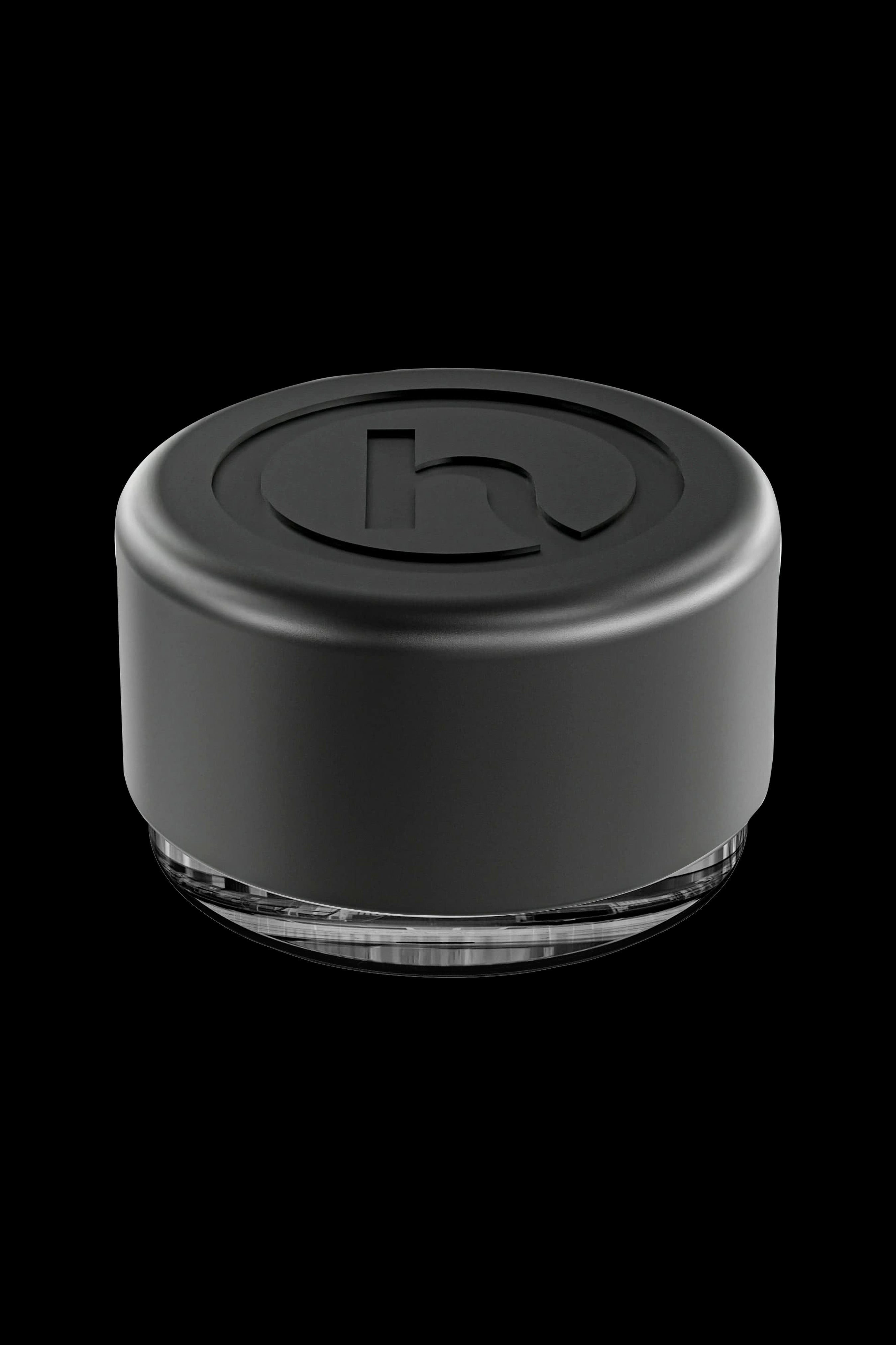Black silicone cannabis concentrate container with clear base.
