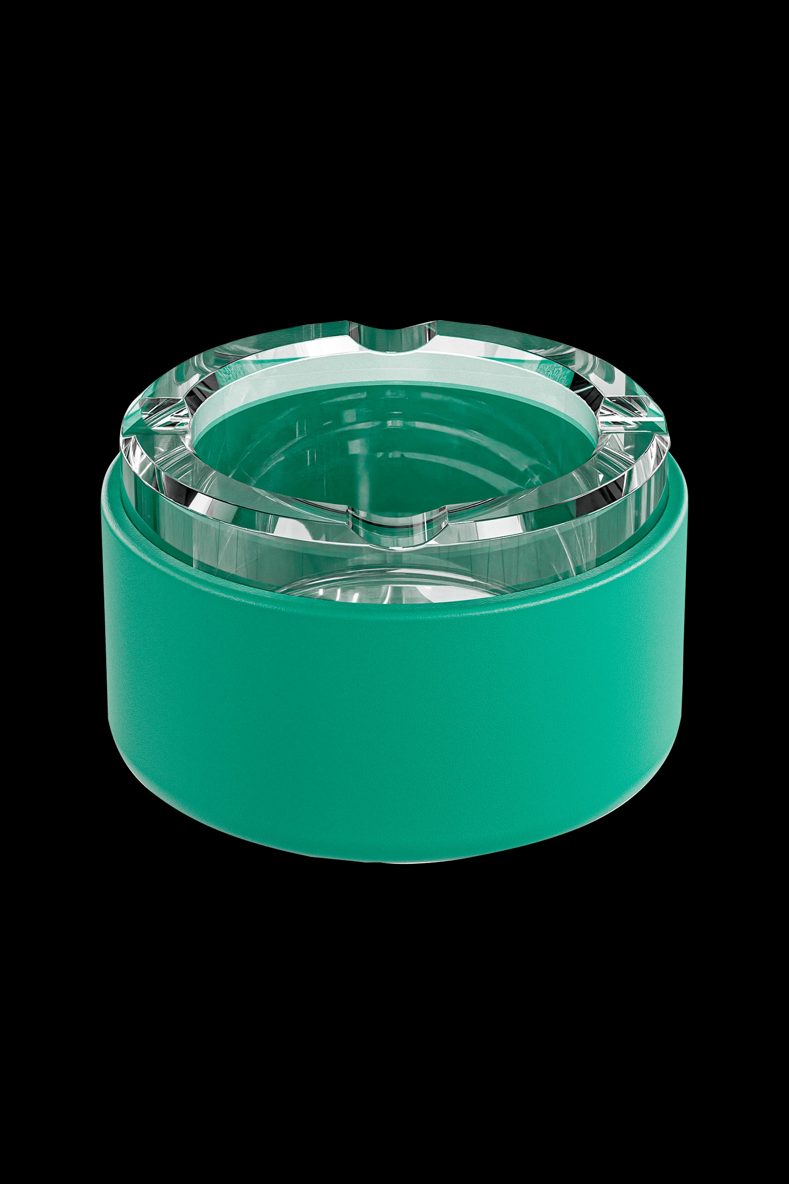 Green glass ashtray or stash jar with a textured, faceted lid.