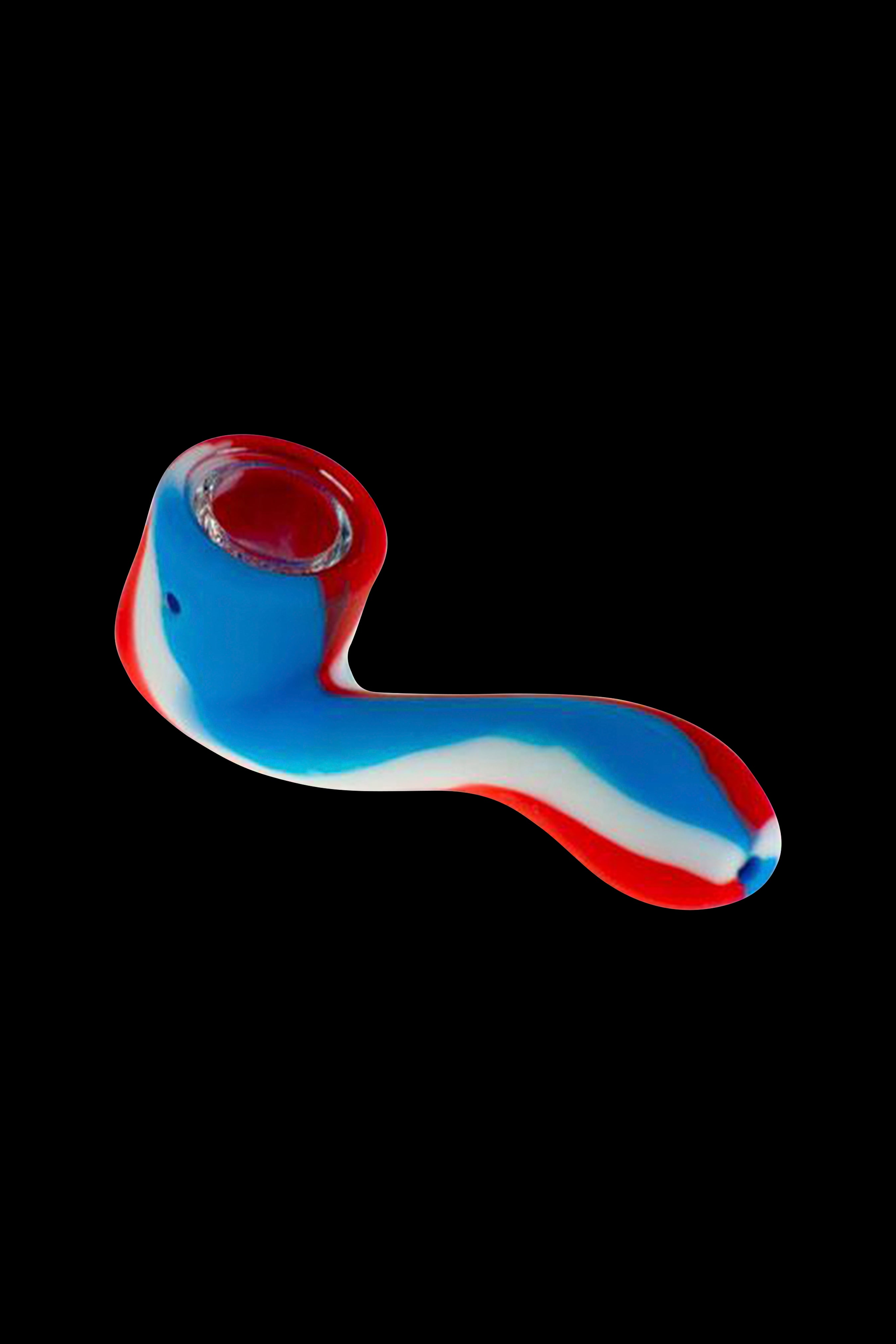 A colorful glass pipe against a black background.