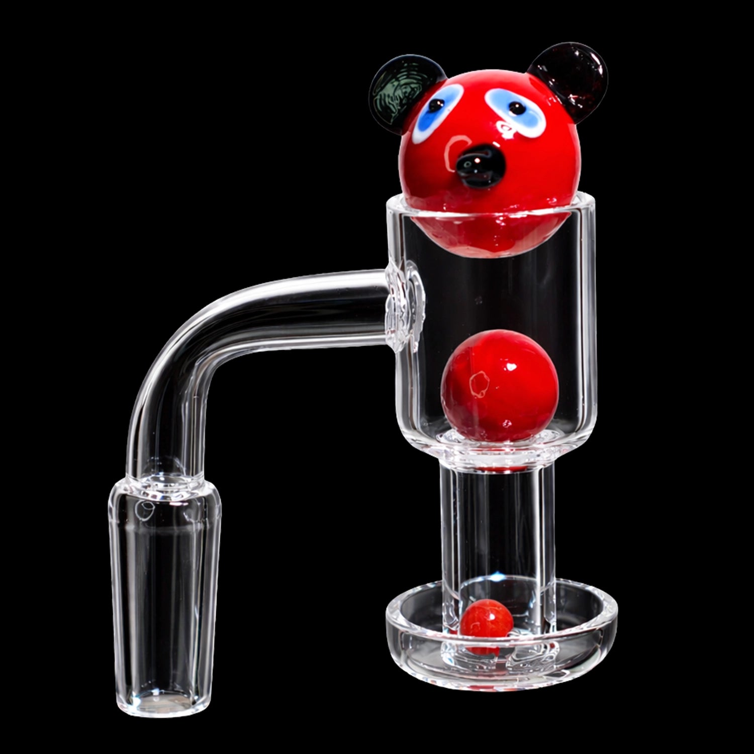 Close-up of the Smoke Cartel Bear Terp Slurper Banger Set - 14mm showing a red bear-head marble and two red spheres inside a clear glass banger against a black background