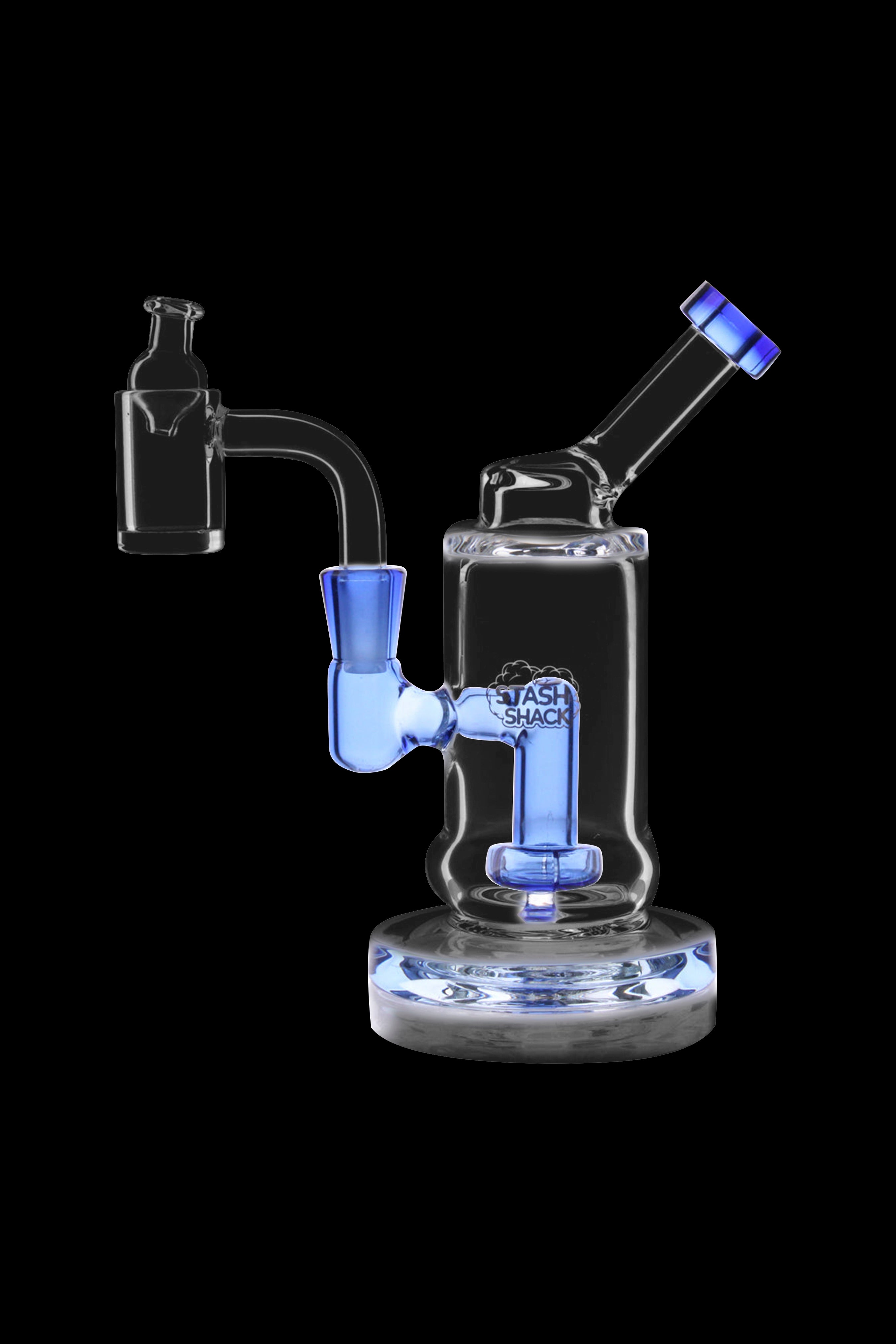 Blue glass dab rig with intricate design and clear base, isolated on a black background.