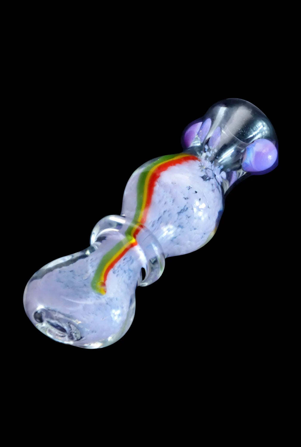 Angled close-up of the Smoke Cartel Frit Rasta One Hitter - 3 in. showing its clear glass body with a central white fritbed and a red-yellow-green rasta stripe.