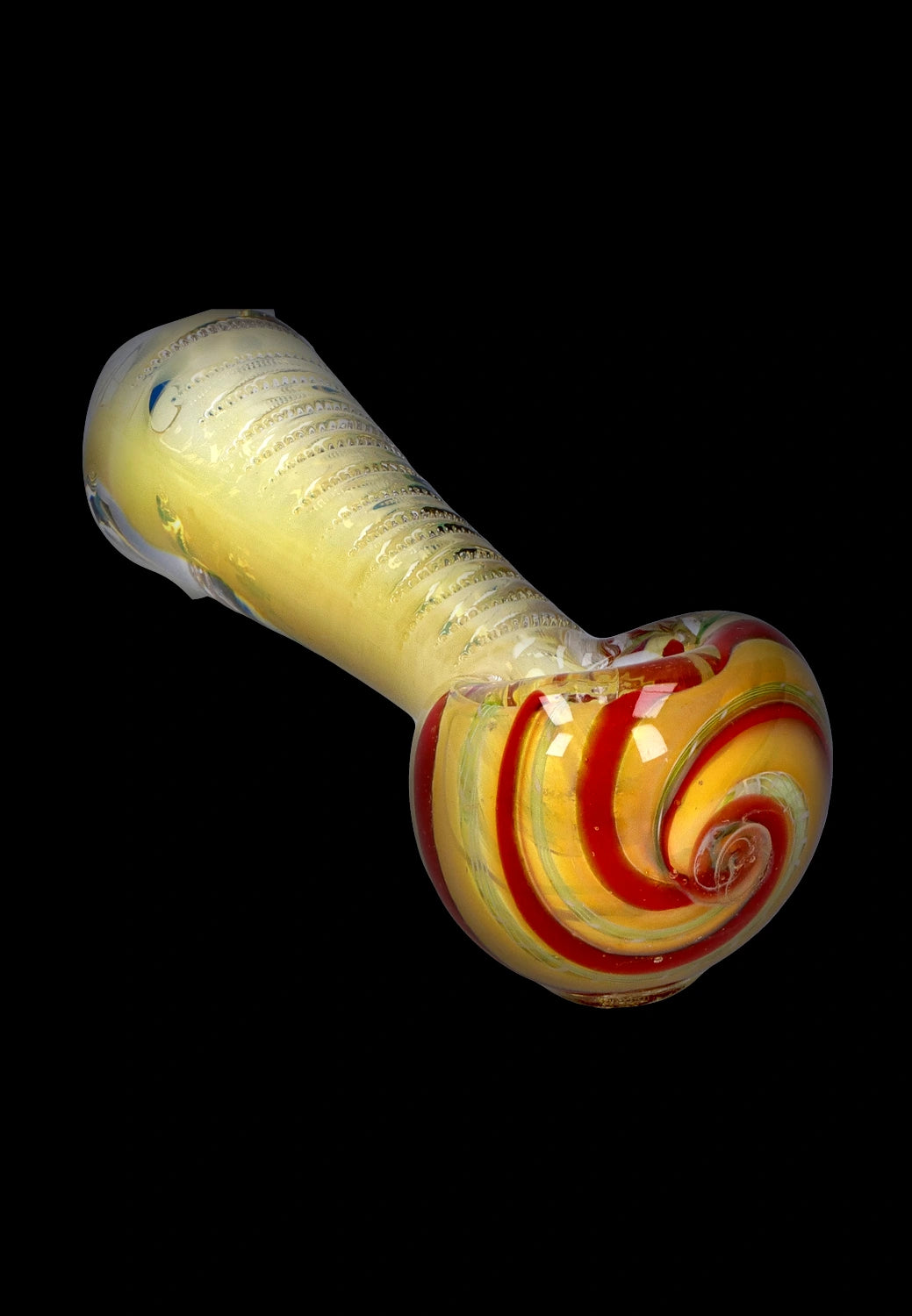 Angled close-up of the Smoke Cartel Engraved Fumed Spoon Pipe - 3 in., showing a yellow body with engraved ribbing and a red-and-yellow spiral bowl on a black background