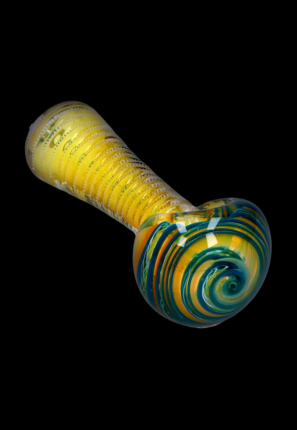 Angled close-up of the Smoke Cartel Engraved Fumed Spoon Pipe - 3 in., showing its yellow fumed body with spiral teal and green swirls on the bowl against a black background
