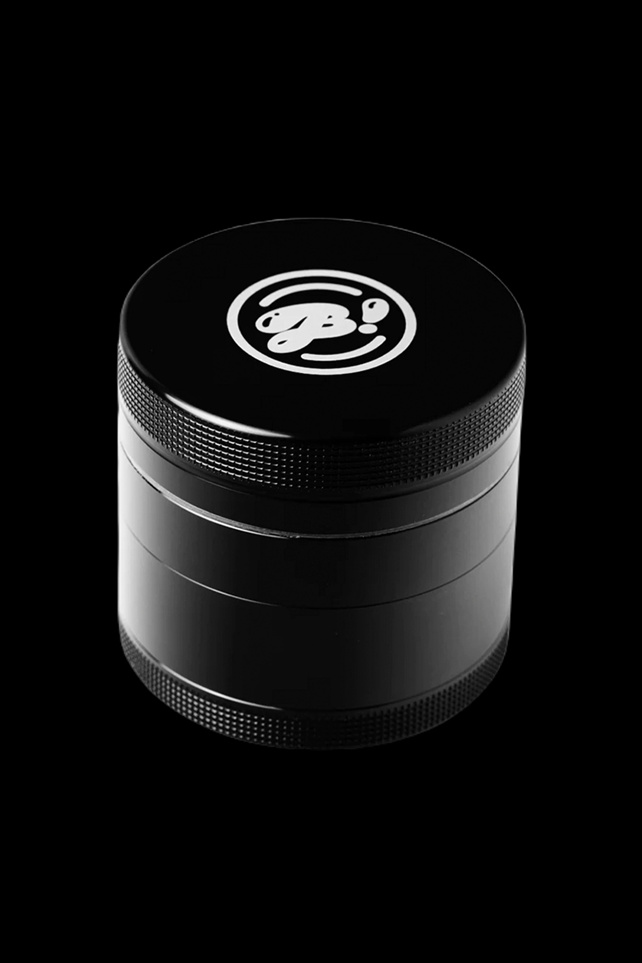 Black four-piece cannabis grinder with a white logo.