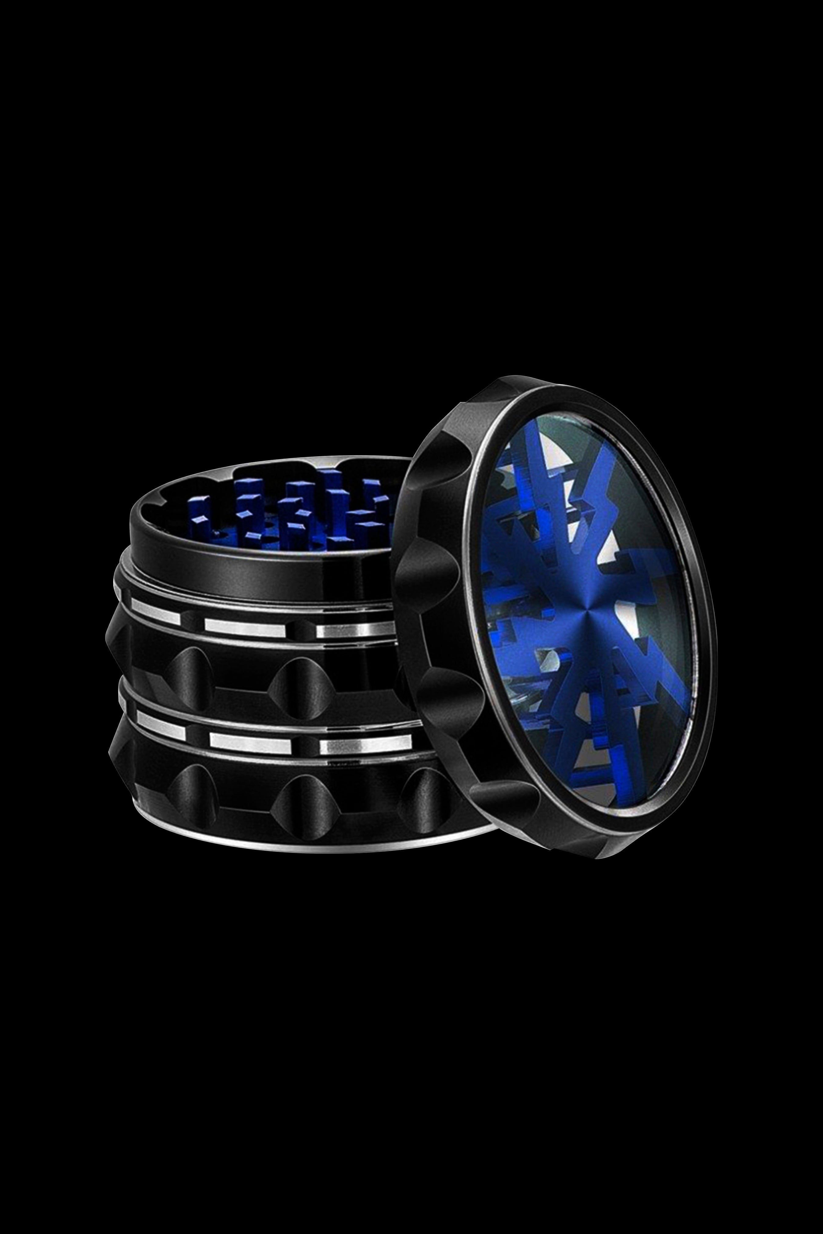 Open black and blue cannabis grinder on a black background.