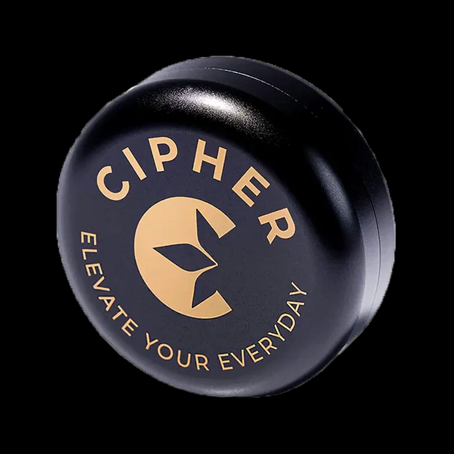 Angled close-up of the Cipher Stor4 Smell-proof Herb Container | 4g in carbon black showing its circular lid with gold logo and lettering against a black background