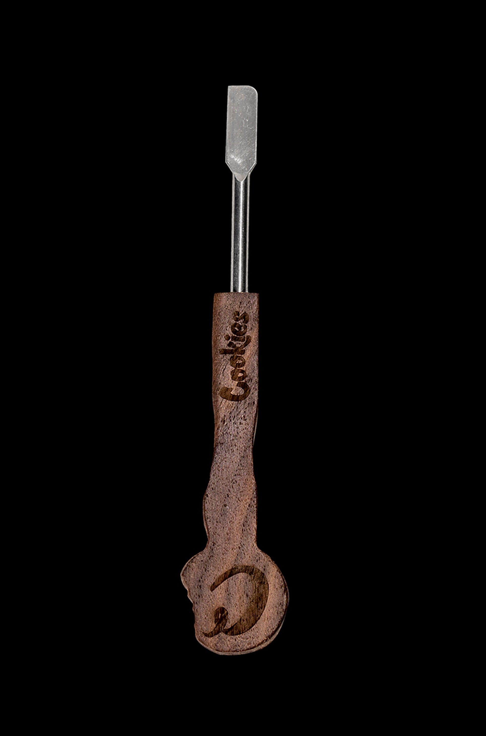 Brown cannabis dab tool with "Cookies" branding against a black background.