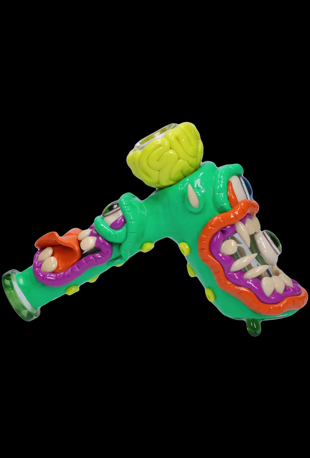 Hand-blown glass cannabis water pipe shaped like a cartoon monster with sharp teeth and vibrant green and orange coloring.