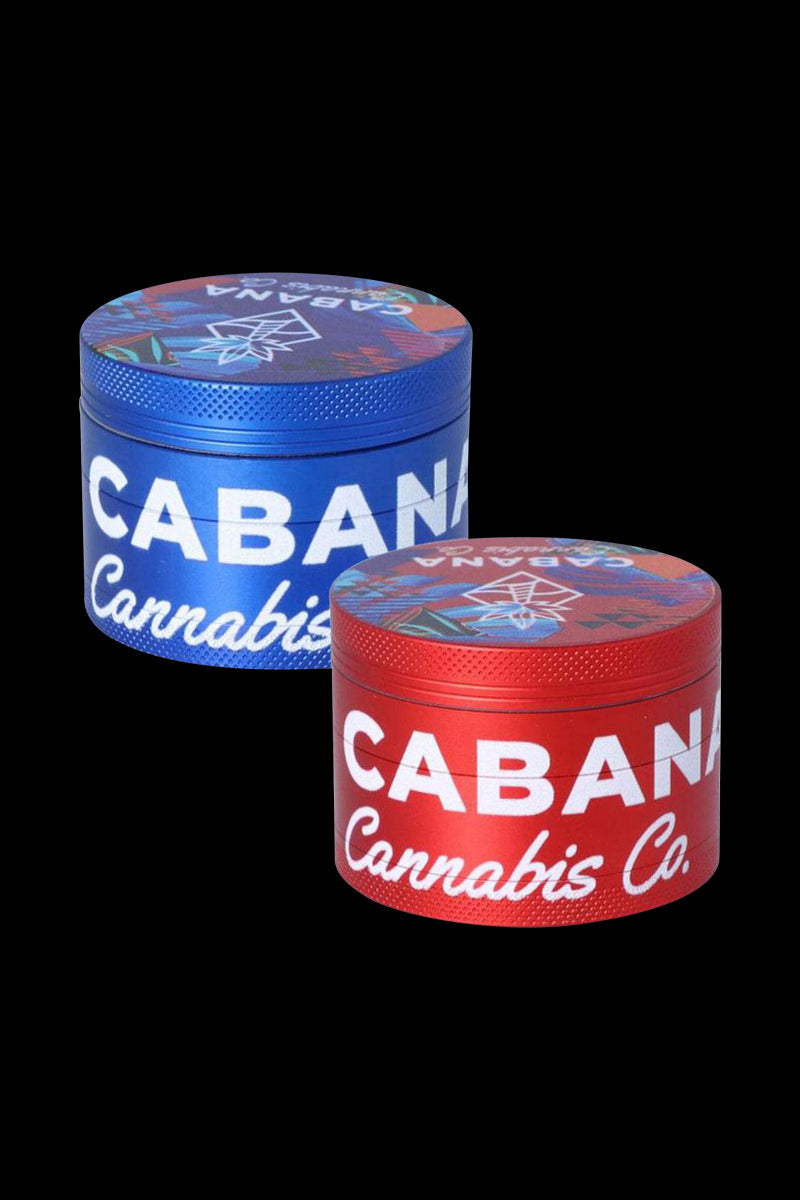 Front view of the Cabana Cannabis Co. 3 Stage Grinder - The Dawn, a metallic blue grinder with a textured surface.