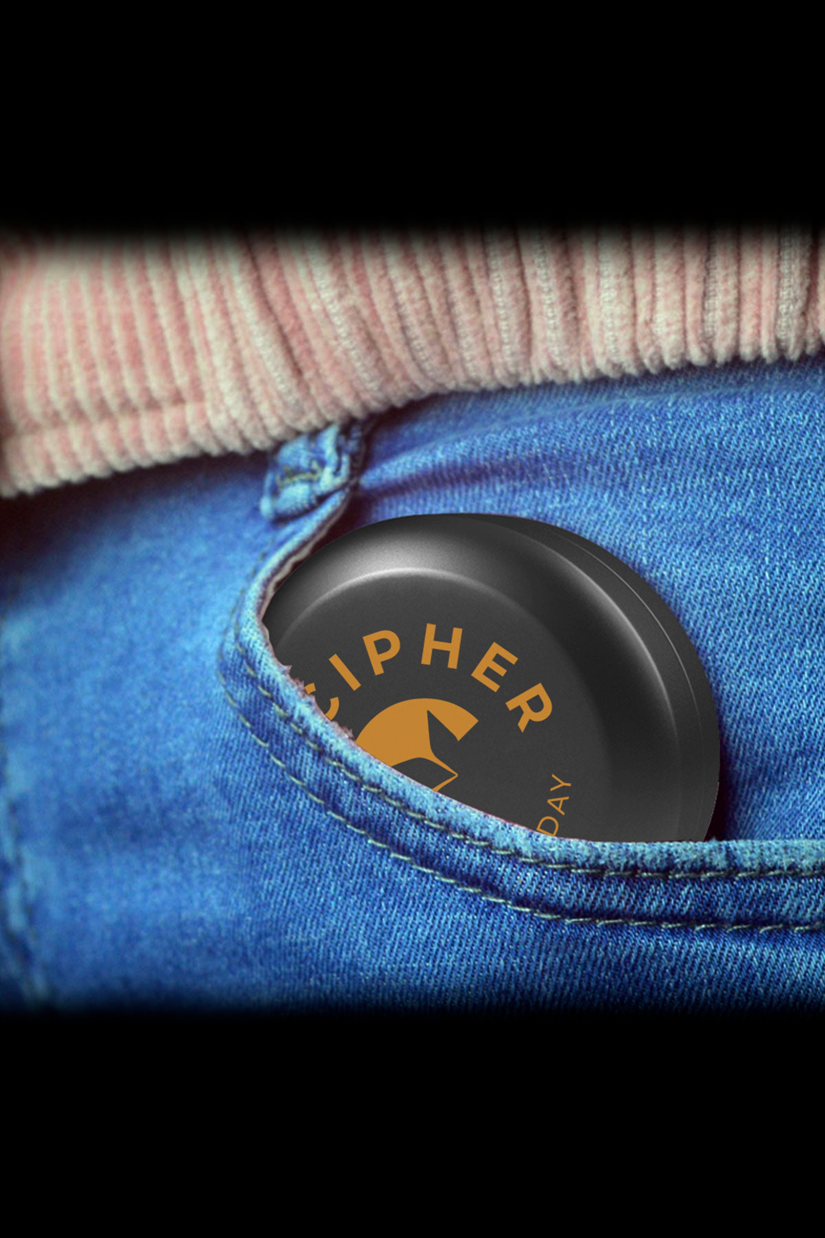 Black cannabis container in a denim pocket.