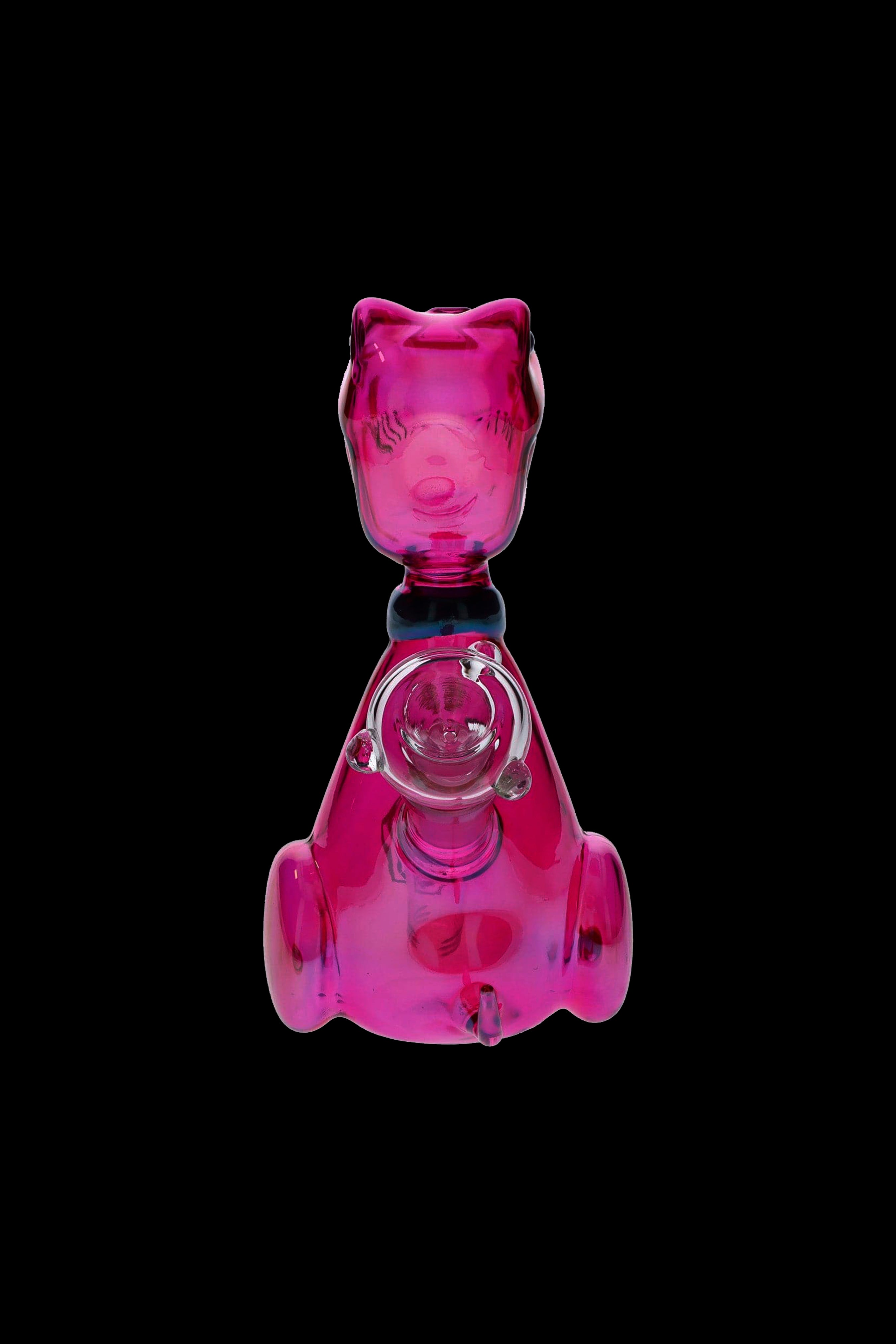 Pink glass bubbler shaped like a cartoon pig, isolated on a black background.