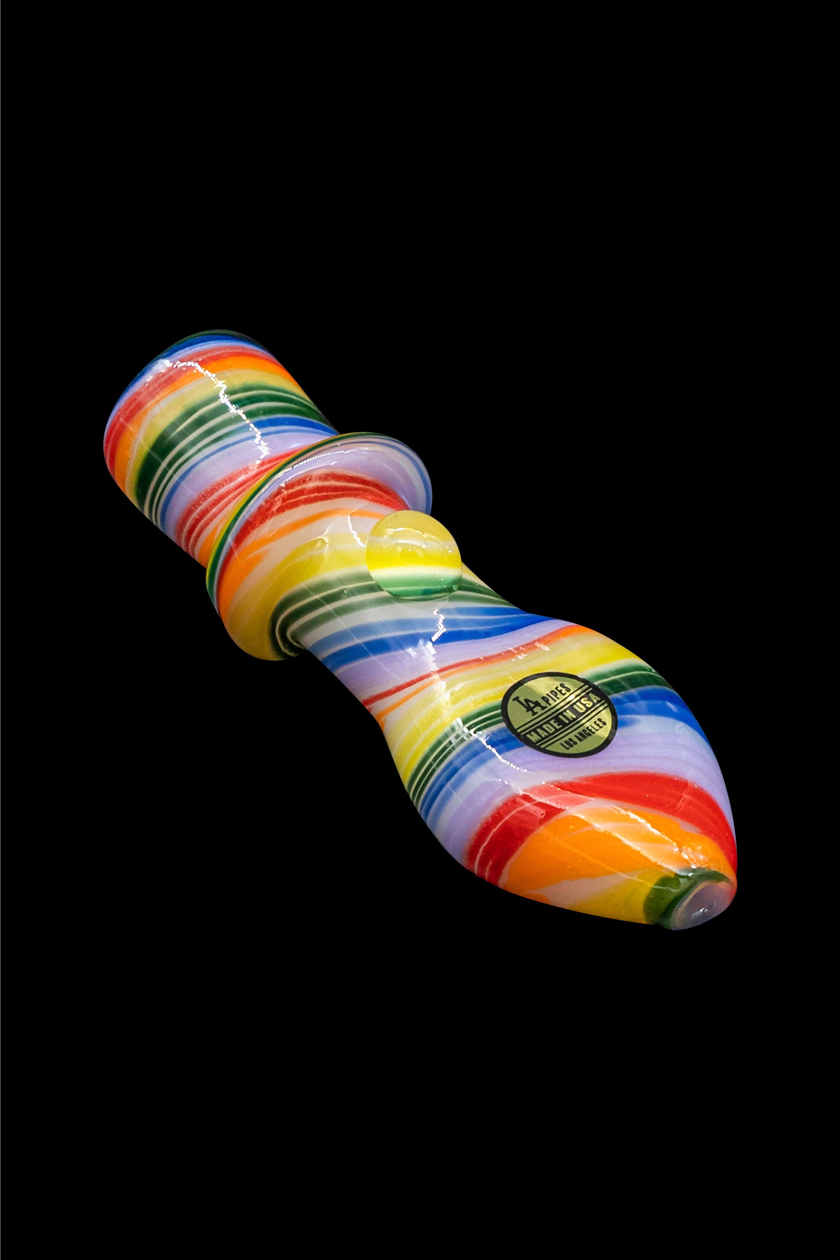 Colorful glass pipe with a “Made in USA” sticker against a black background.