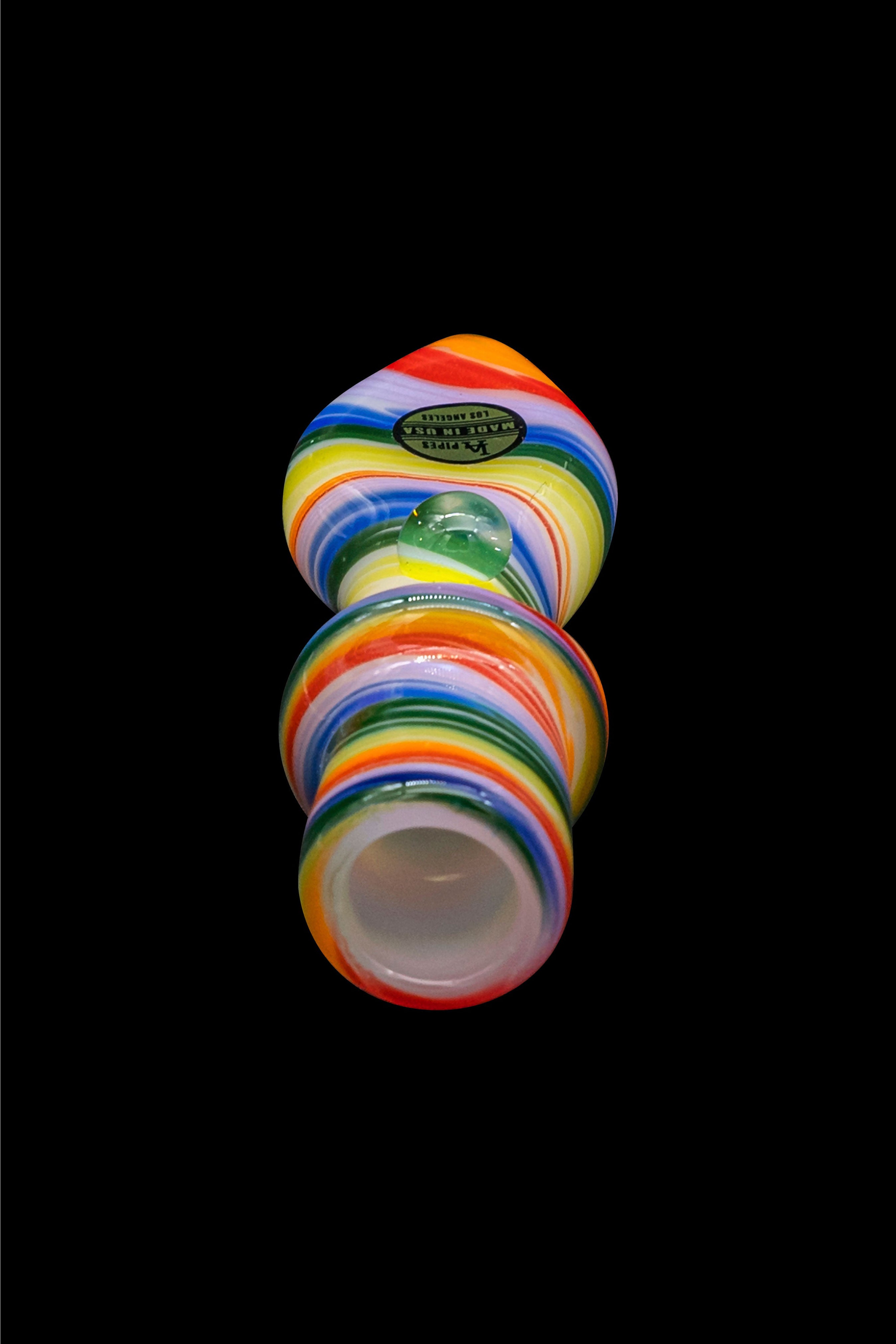 Colorful glass water pipe isolated on a black background.