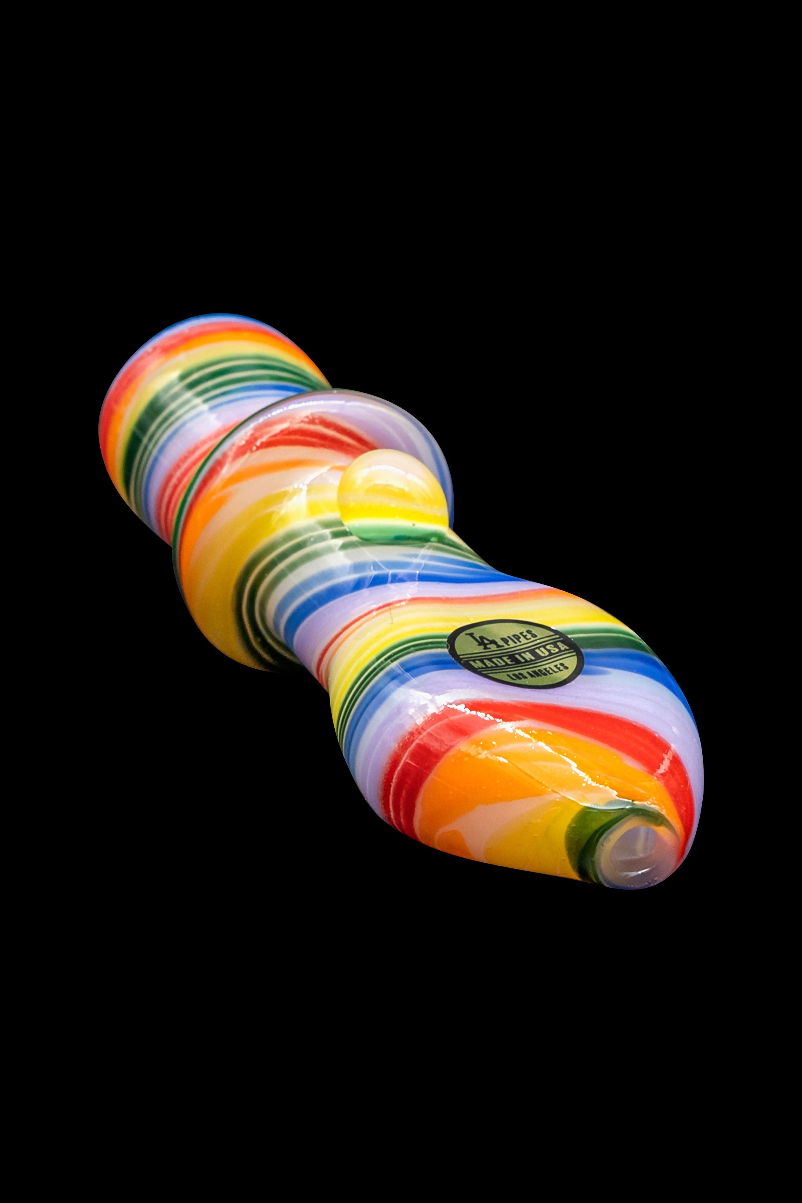 Colorful glass cannabis water pipe on a black background.
